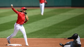 Miami Marlins' Xavier Edwards, right, is out at second base as Washington Nationals second baseman CJ Abrams, left, throws to first base to put out Marlins' Javier Sanoja for a double-play during the second inning of a baseball game, Sunday, Aug. 30, 2026, in Washington. (AP Photo/Nick Wass)