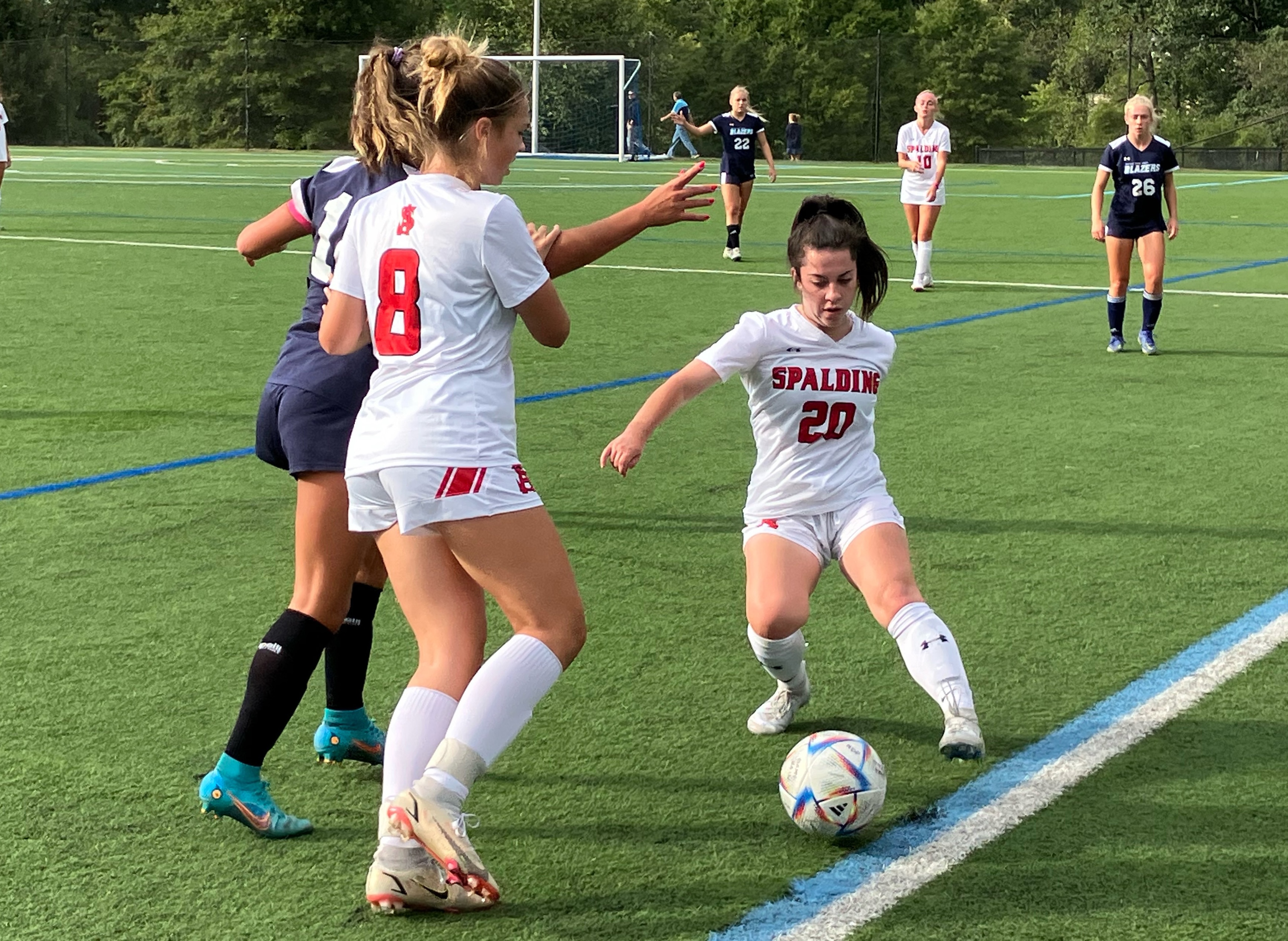 Archbishop Spalding junior defender Chloe Stroheacker (8) and senior midfielder Emma Coyne (20), right, converge on Notre Dame Prep senior midfielder Natalie O’Brocki along the sideline in Wednesday’s IAAM A Conference opener in Towson. The No. 1 Cavaliers prevailed, 1-0, over the fourth-ranked Blazers.