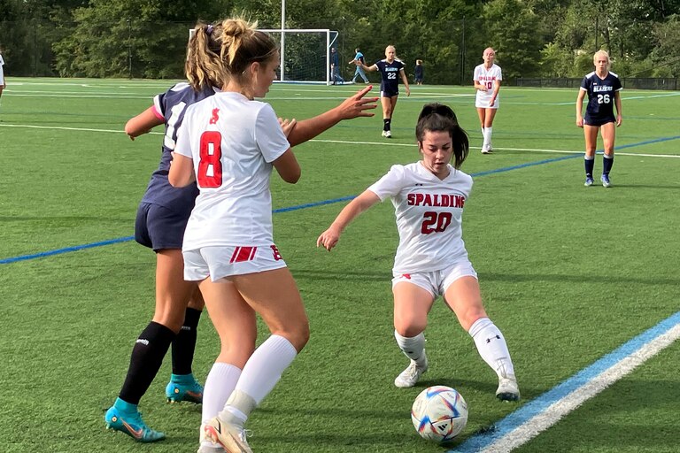 Archbishop Spalding junior defender Chloe Stroheacker (8) and senior midfielder Emma Coyne (20), right, converge on Notre Dame Prep senior midfielder Natalie O’Brocki along the sideline in Wednesday’s IAAM A Conference opener in Towson. The No. 1 Cavaliers prevailed, 1-0, over the fourth-ranked Blazers.