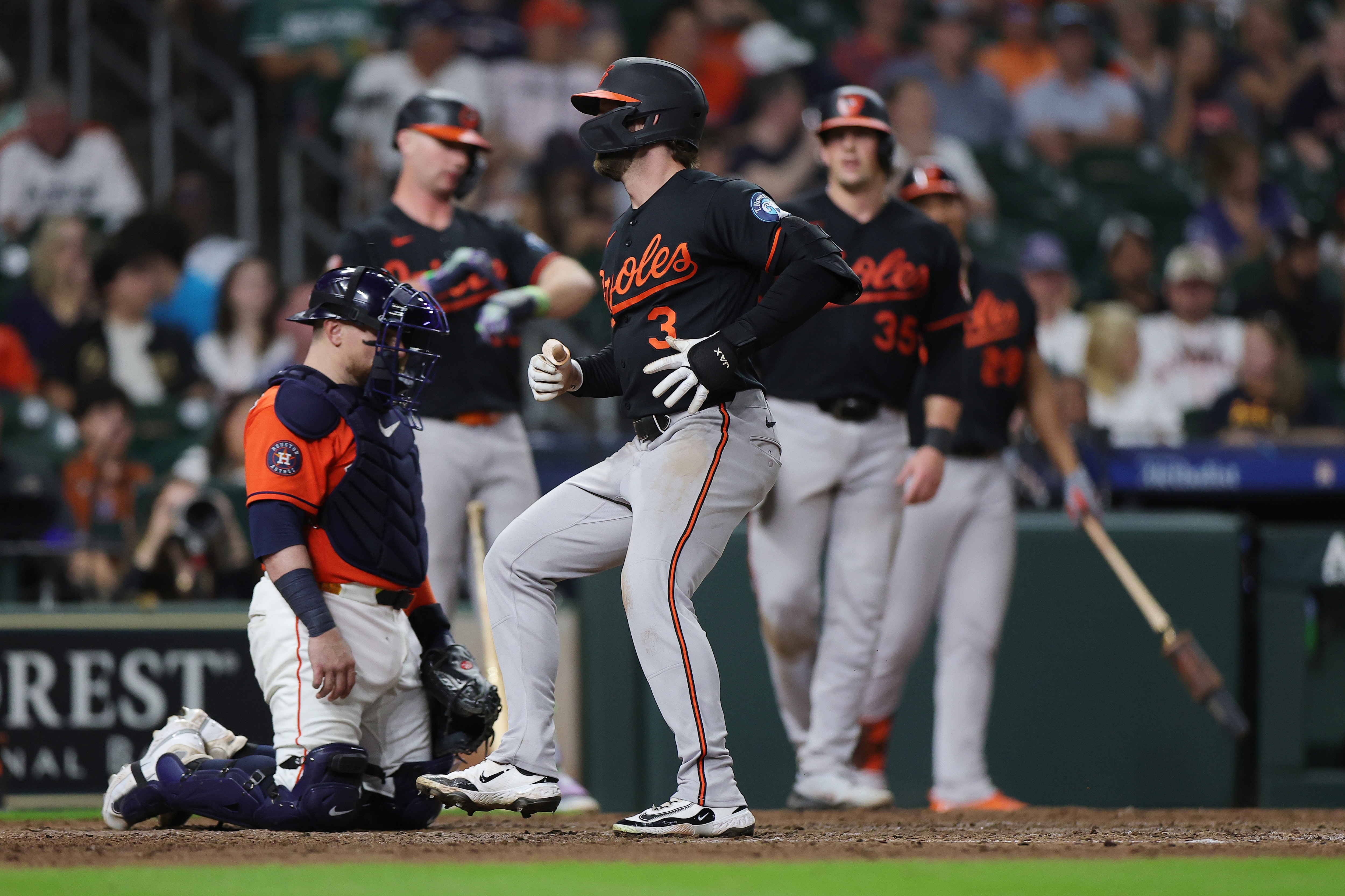 Taylor Ward crosses home plate after hitting the two-run, eighth-inning home run that lifted the Orioles over the Astros on Friday night.