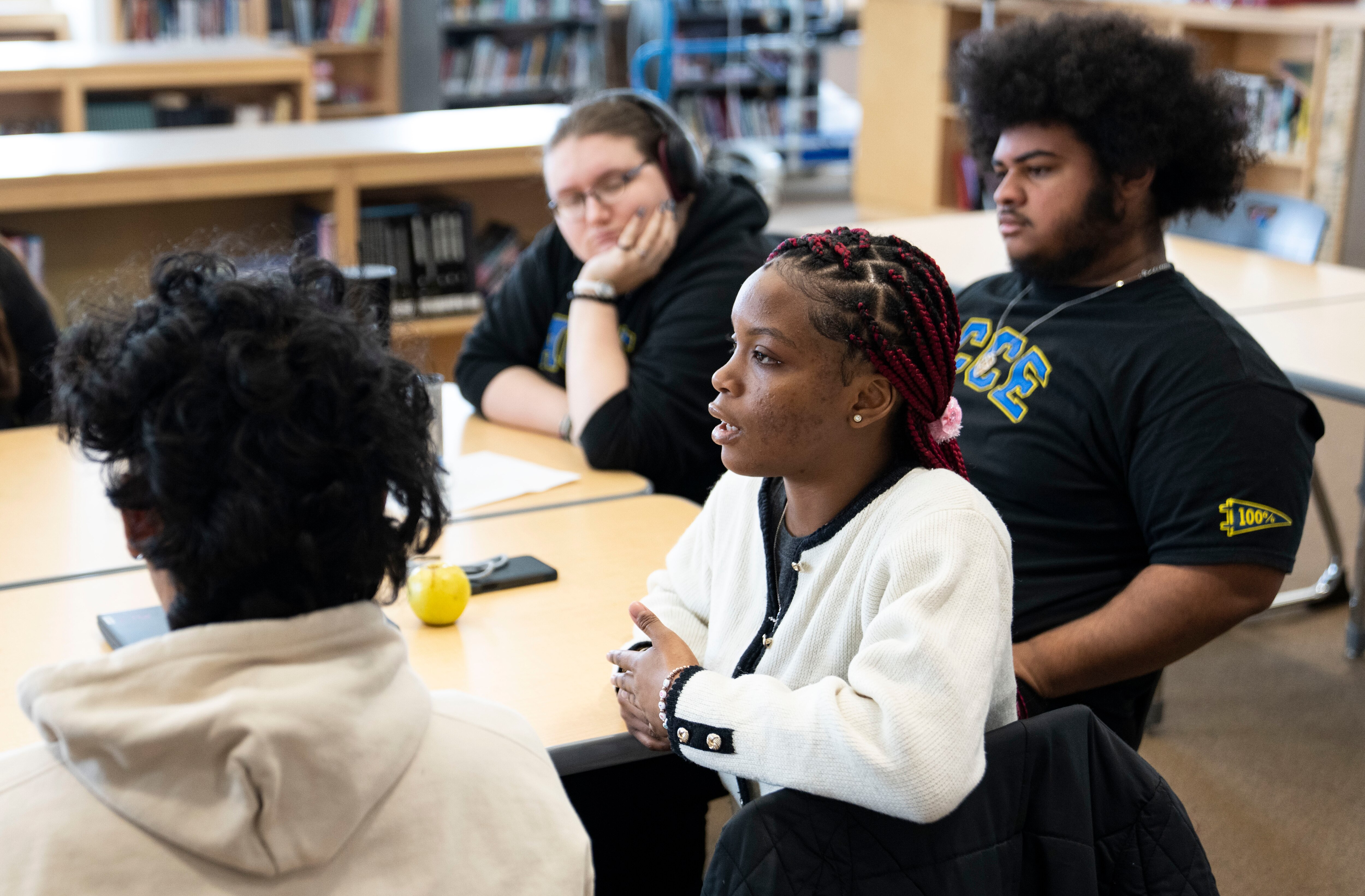 Favour J. speaks about national politics with Baltimore Banner reporter Jessica Calefati at Academy for College and Career Exploration, in Baltimore, Monday January 13, 2025.