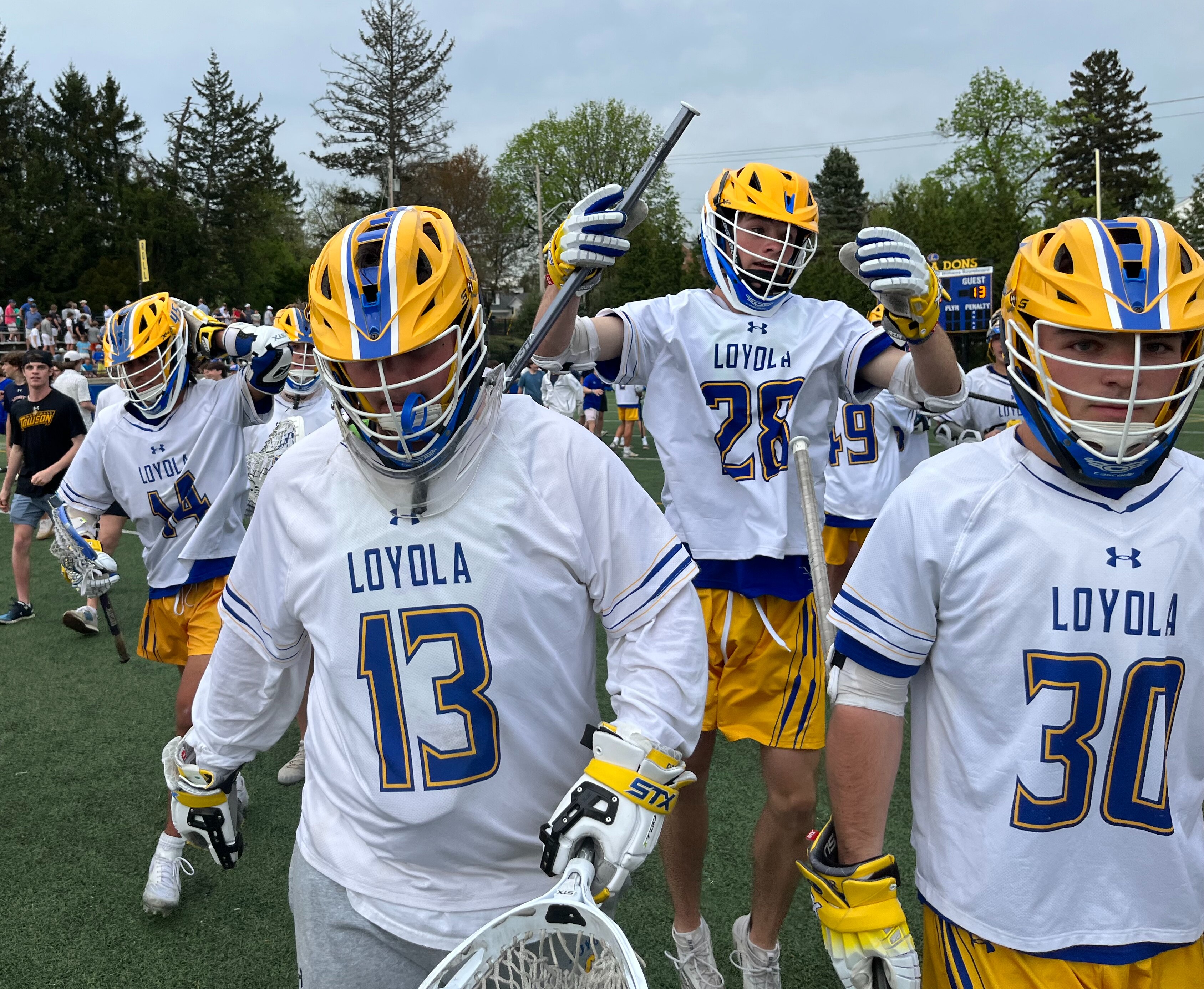 Loyola goalie Bennett Wright (13) walks the field after Friday's epic lacrosse match with McDonogh. Wright stopped McCabe Millon's shot in the waning seconds as No. 3 Loyola claimed first place in the MIAA A Conference with a 14-13 victory over the top-ranked and nation's No. 2 Eagles at Hargaden Field in Towson.