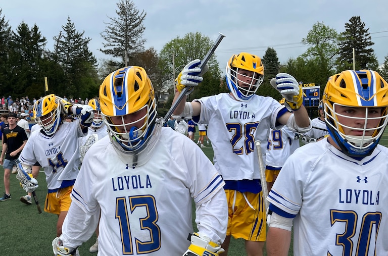 Loyola goalie Bennett Wright (13) walks the field after Friday's epic lacrosse match with McDonogh. Wright stopped McCabe Millon's shot in the waning seconds as No. 3 Loyola claimed first place in the MIAA A Conference with a 14-13 victory over the top-ranked and nation's No. 2 Eagles at Hargaden Field in Towson.