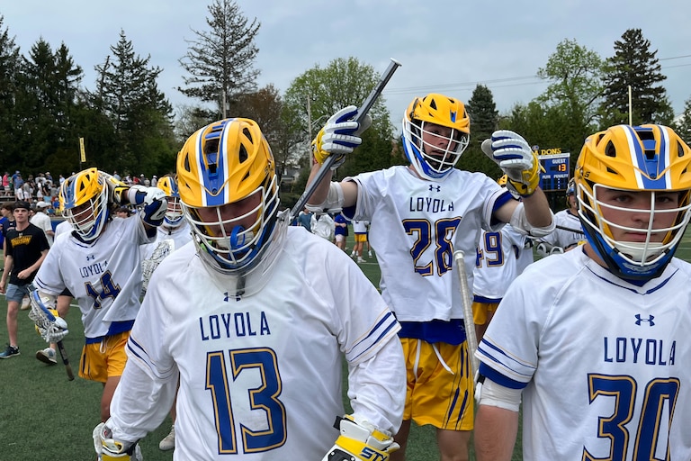 Loyola goalie Bennett Wright (13) walks the field after Friday's epic lacrosse match with McDonogh. Wright stopped McCabe Millon's shot in the waning seconds as No. 3 Loyola claimed first place in the MIAA A Conference with a 14-13 victory over the top-ranked and nation's No. 2 Eagles at Hargaden Field in Towson.