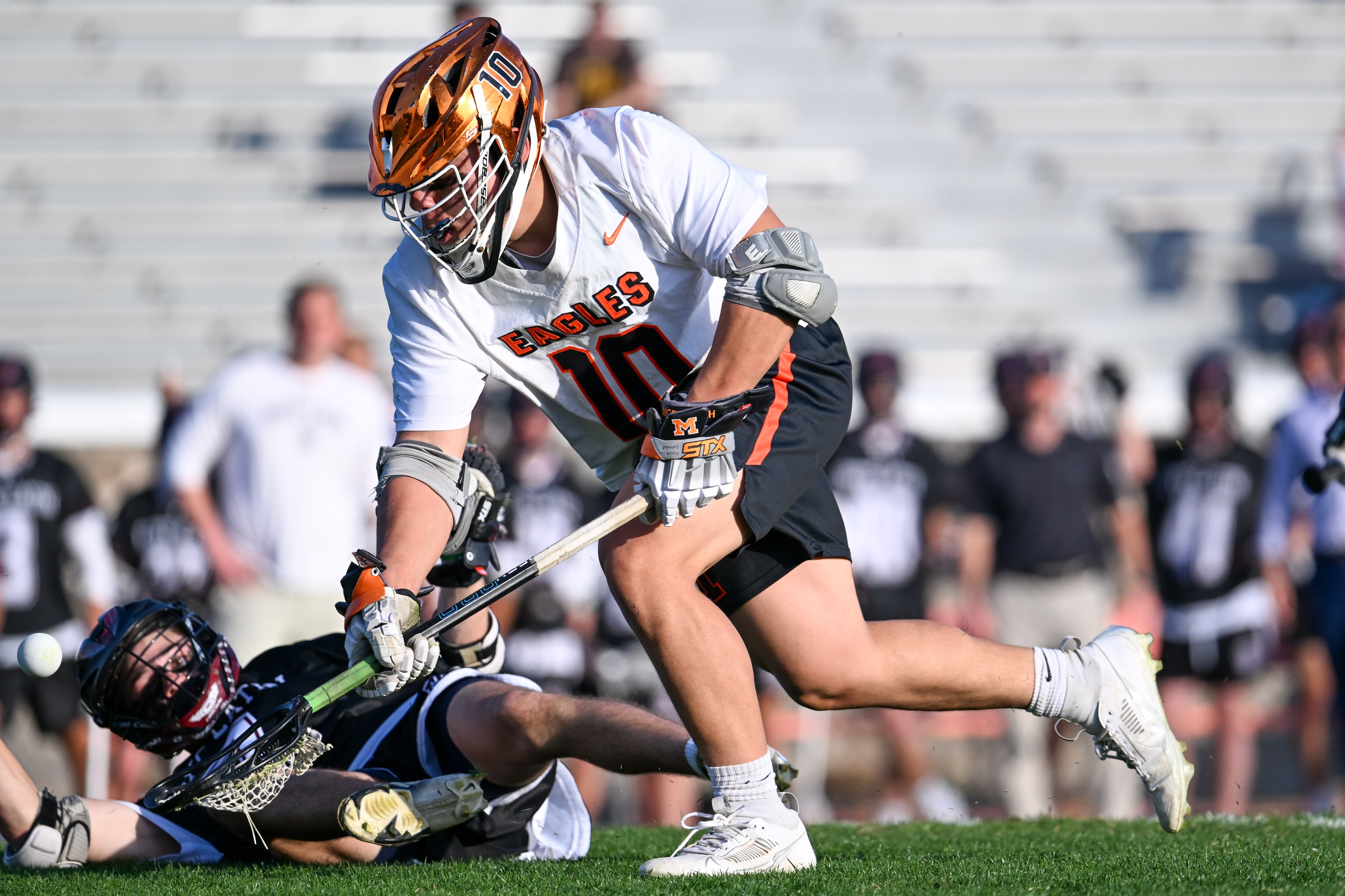 McDonogh's Zach Hayashi claims one of his 18 faceoff victories Tuesday against Boys' Latin in a MIAA A Conference lacrosse showdown.
