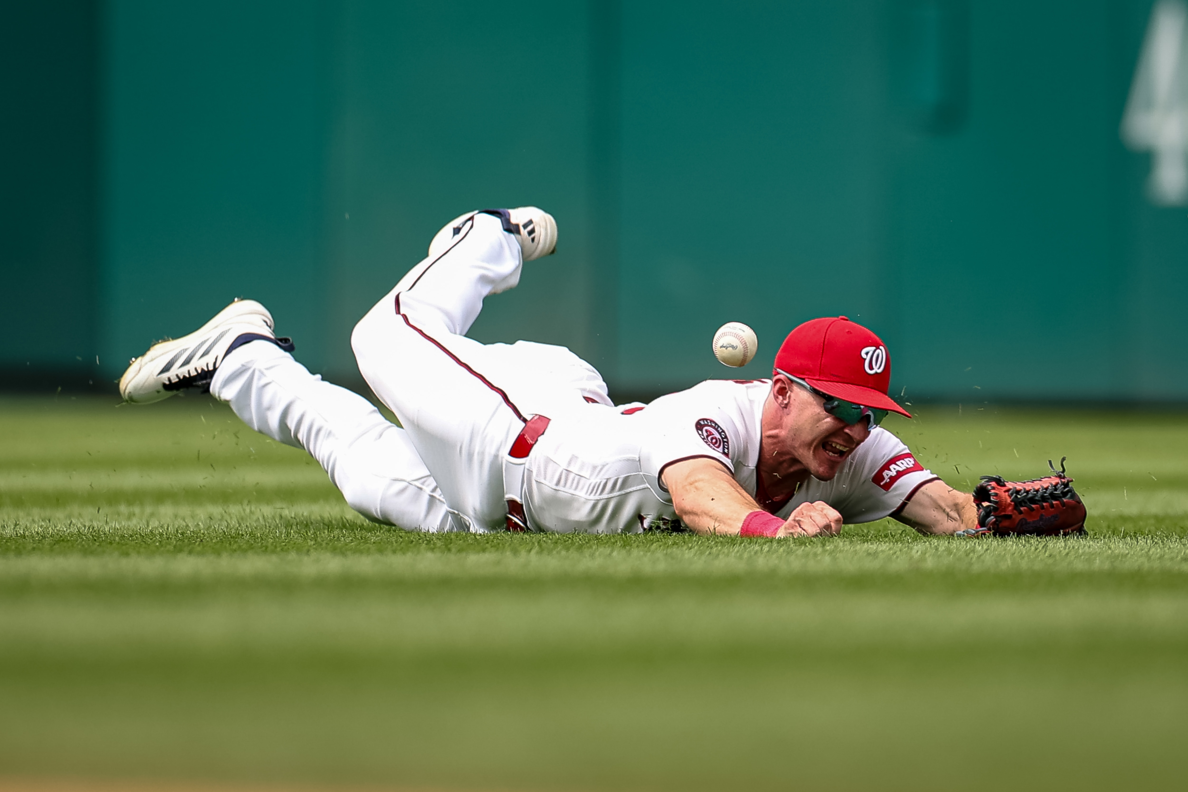 Jacob Young makes a diving attempt to catch a ball during the eighth inning. The play resulted in a two-run double for Toronto’s Kazuma Okamoto.