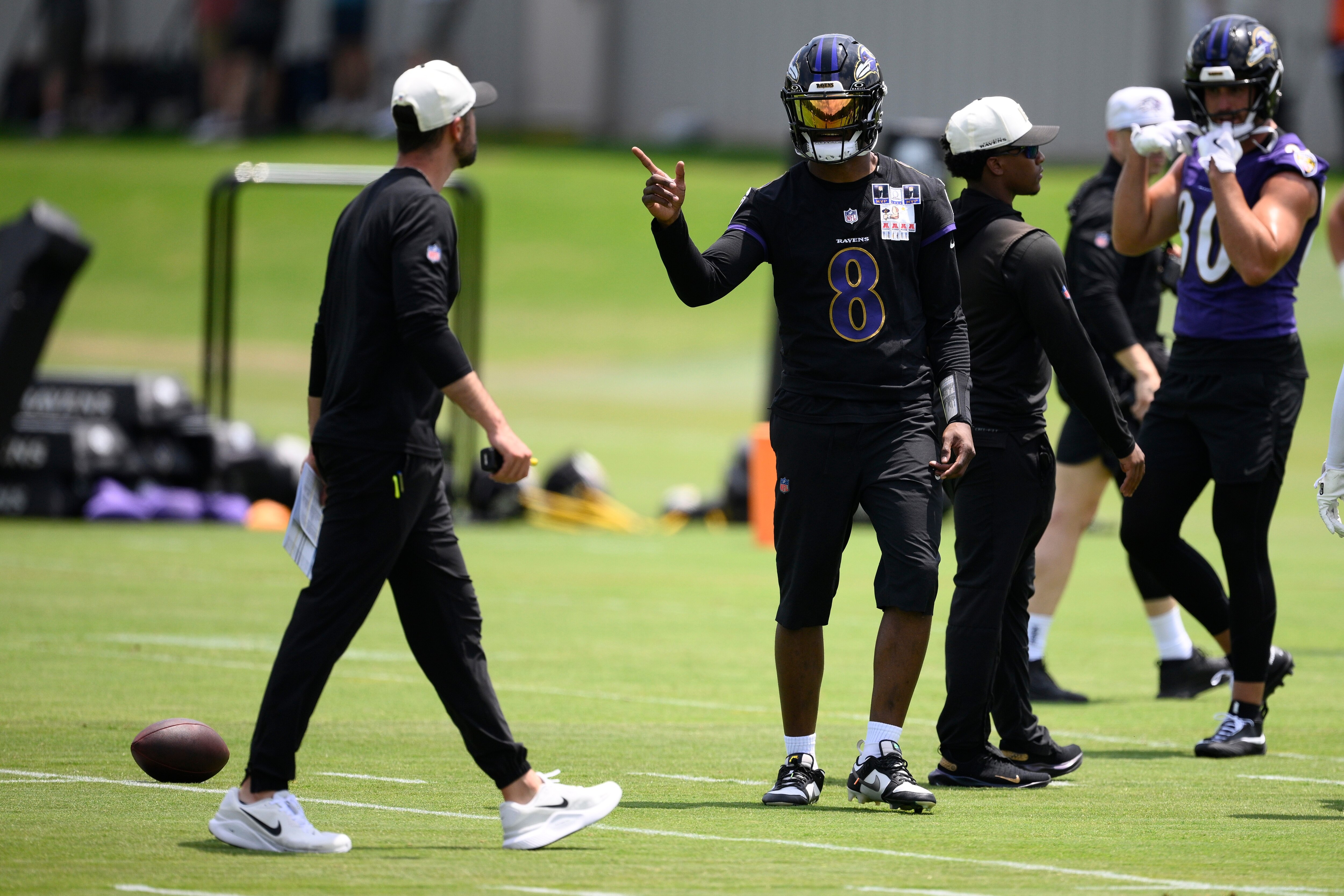 Baltimore Ravens quarterback Lamar Jackson (8) gestures during NFL football practice, Wednesday, June 10, 2026, in Owings Mills, Md.