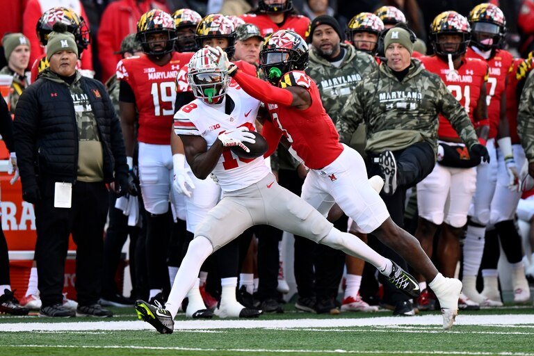 COLLEGE PARK, MARYLAND - NOVEMBER 19: Marvin Harrison Jr. #18 of the Ohio State Buckeyes makes a catch in the first quarter against Deonte Banks #3 of the Maryland Terrapins at SECU Stadium on November 19, 2022 in College Park, Maryland.