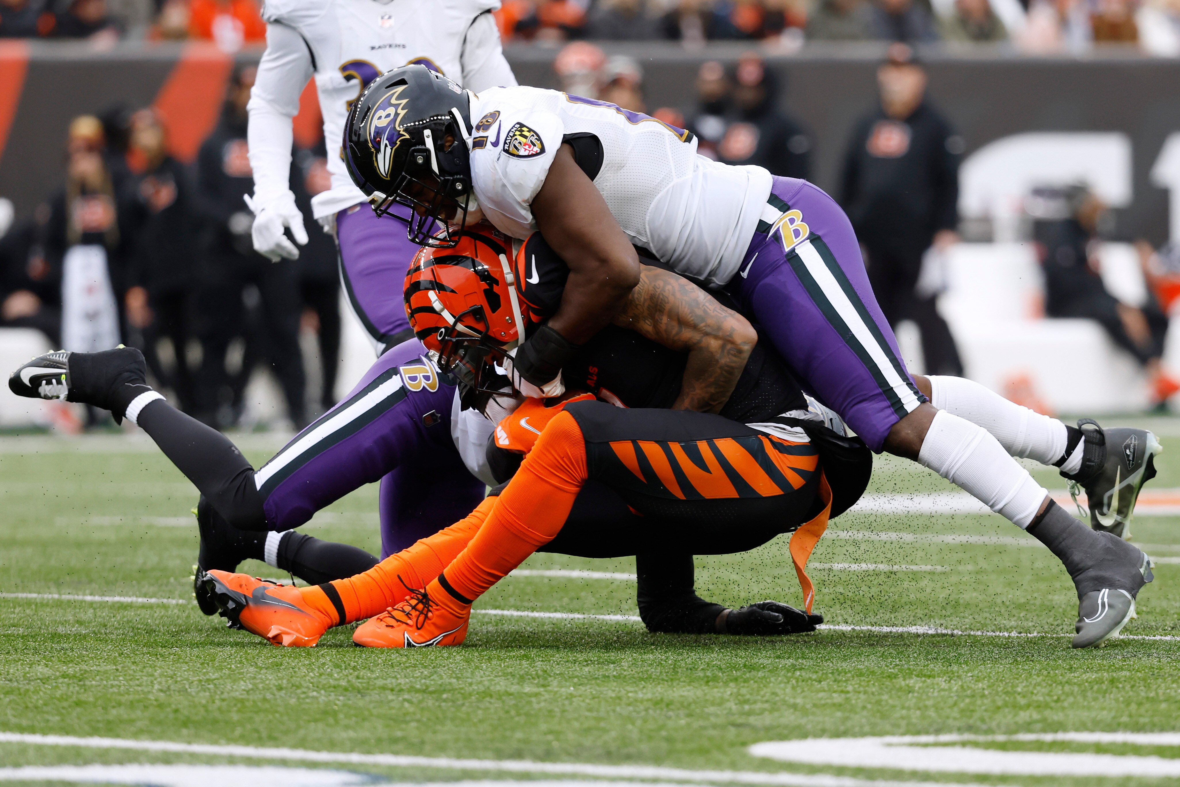 CINCINNATI, OHIO - JANUARY 08: Ja'Marr Chase #1 of the Cincinnati Bengals is tackled by Roquan Smith #18 of the Baltimore Ravens during the third quarter at Paycor Stadium on January 08, 2023 in Cincinnati, Ohio. (Photo by Kirk Irwin/Getty Images)