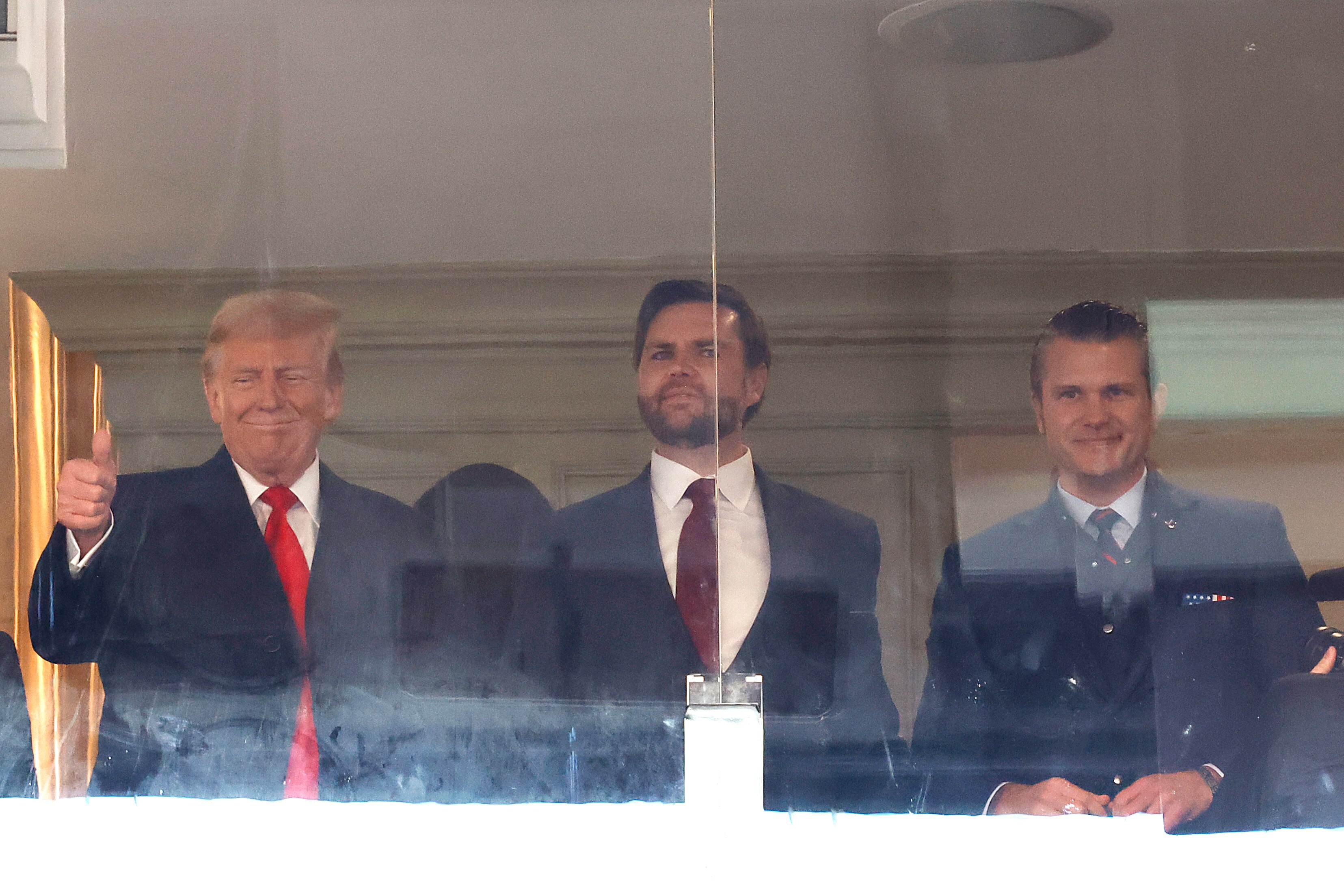 Donald Trump and JD Vance, then the president-elect and vice president-elect, attend the 125th Army-Navy football game at Northwest Stadium on December 14, 2024, in Landover. On the right is then-Defense Secretary nominee Pete Hegseth.