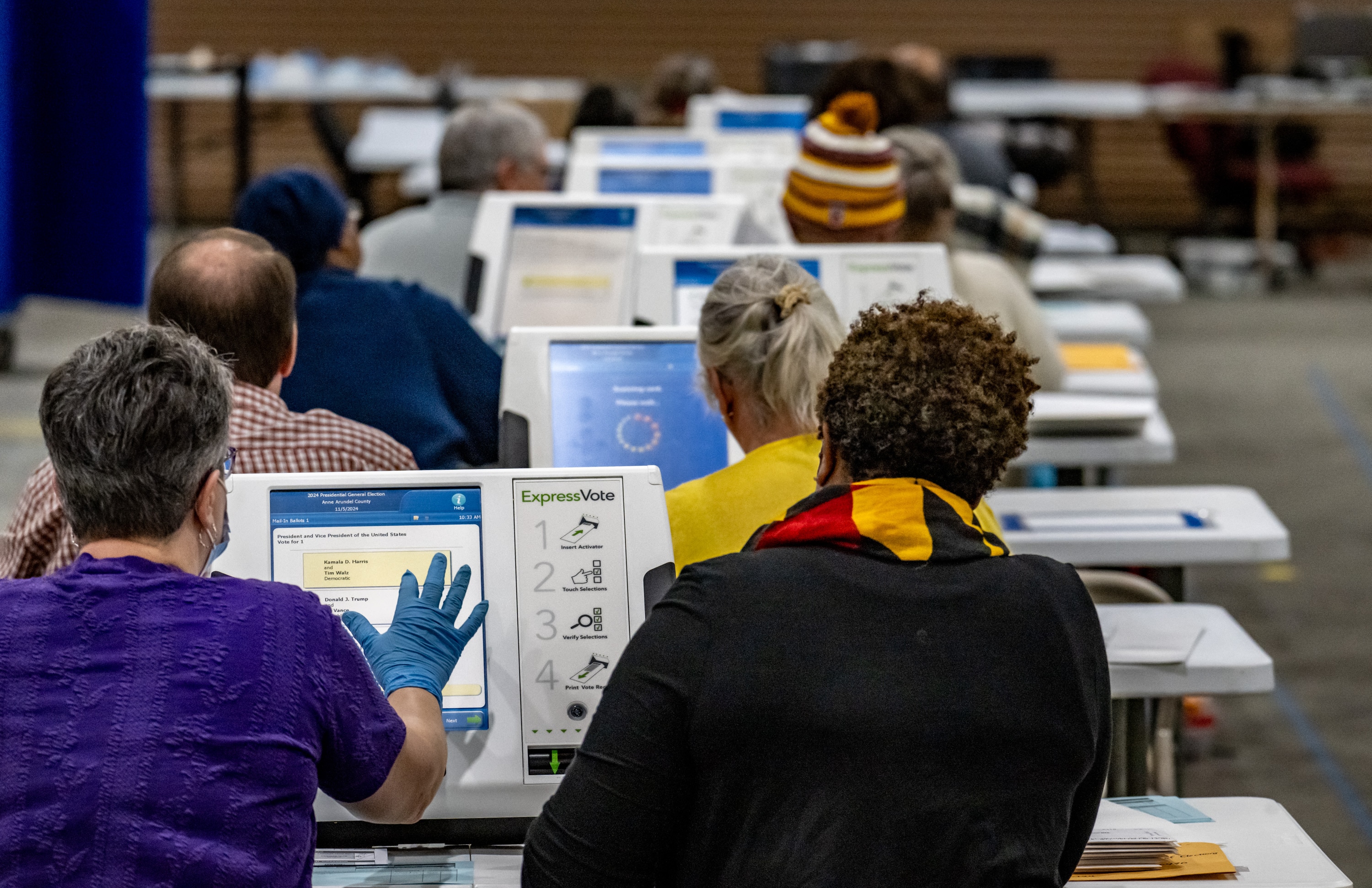 Bi-partisan teams enter votes electronically from emailed ballots during canvassing at the Anne Arundel County Board of Elections.