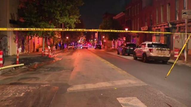Baltimore Police gather near the scene where a man was shot and killed by police officers in Southwest Baltimore late on Monday, Aug. 5, 2024.