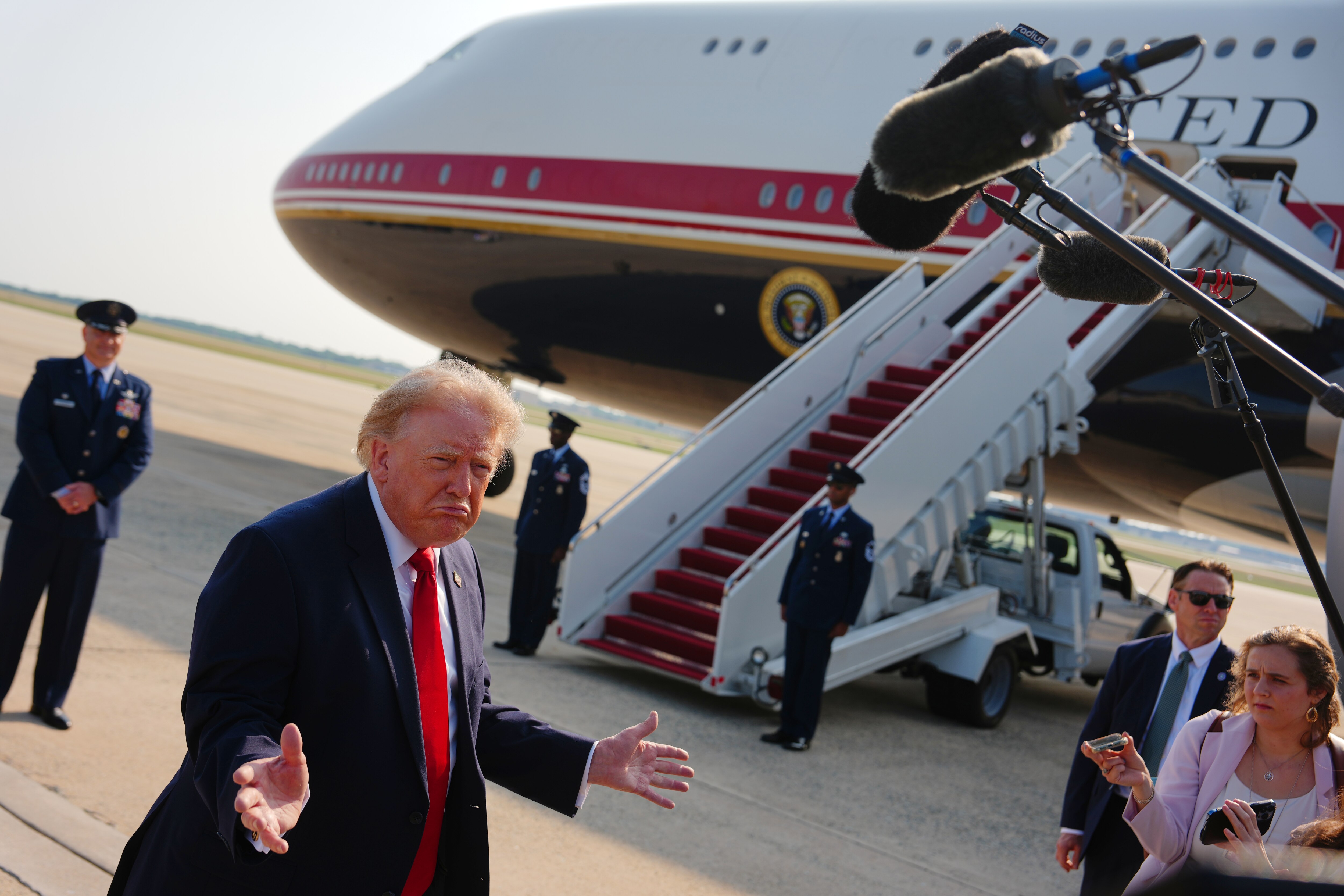 President Donald Trump speaks to reporters before boarding Air Force One at Joint Base Andrews on Wednesday.
