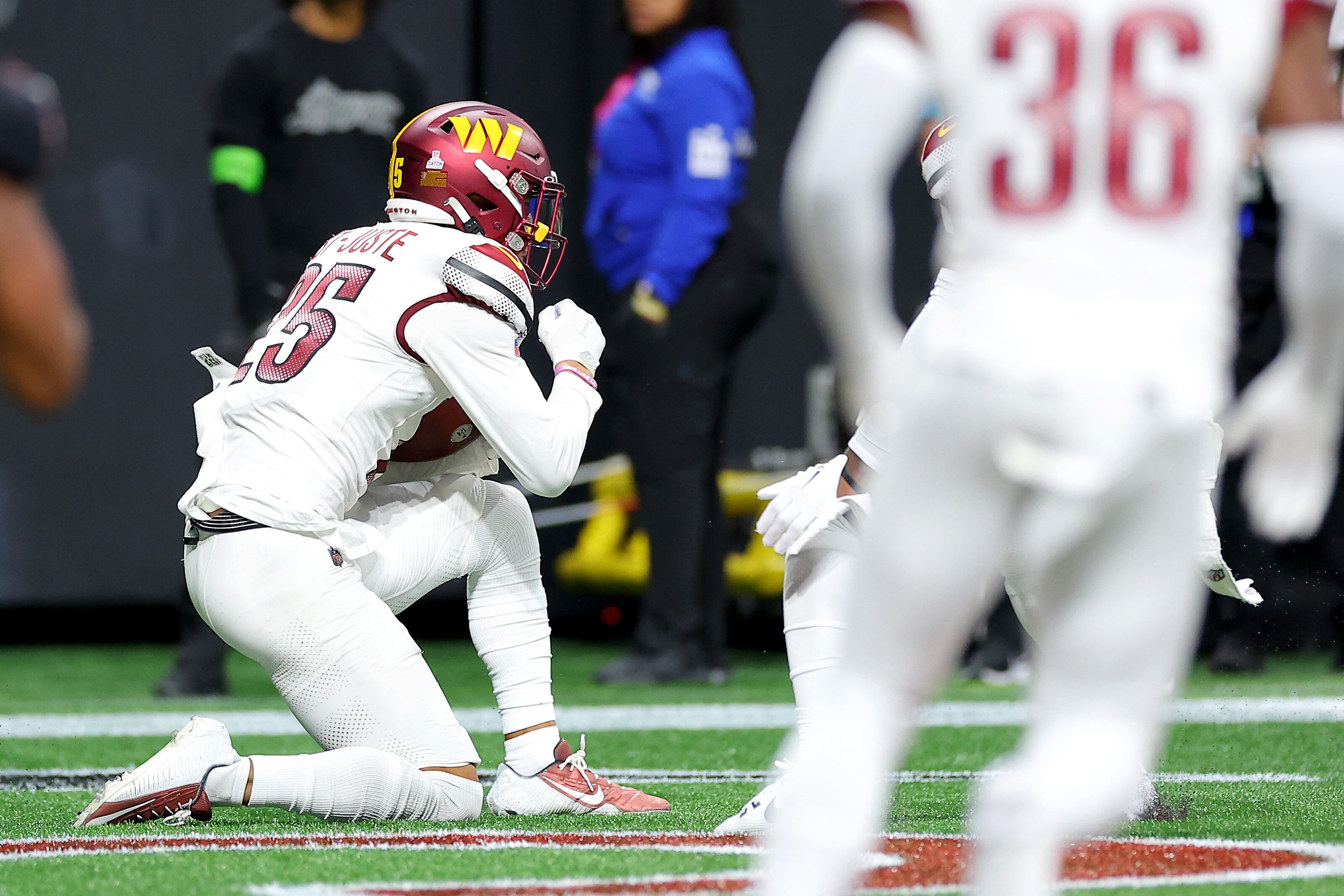 The Commanders' Benjamin St-Juste gets pumped after intercepting a pass against the Falcons.