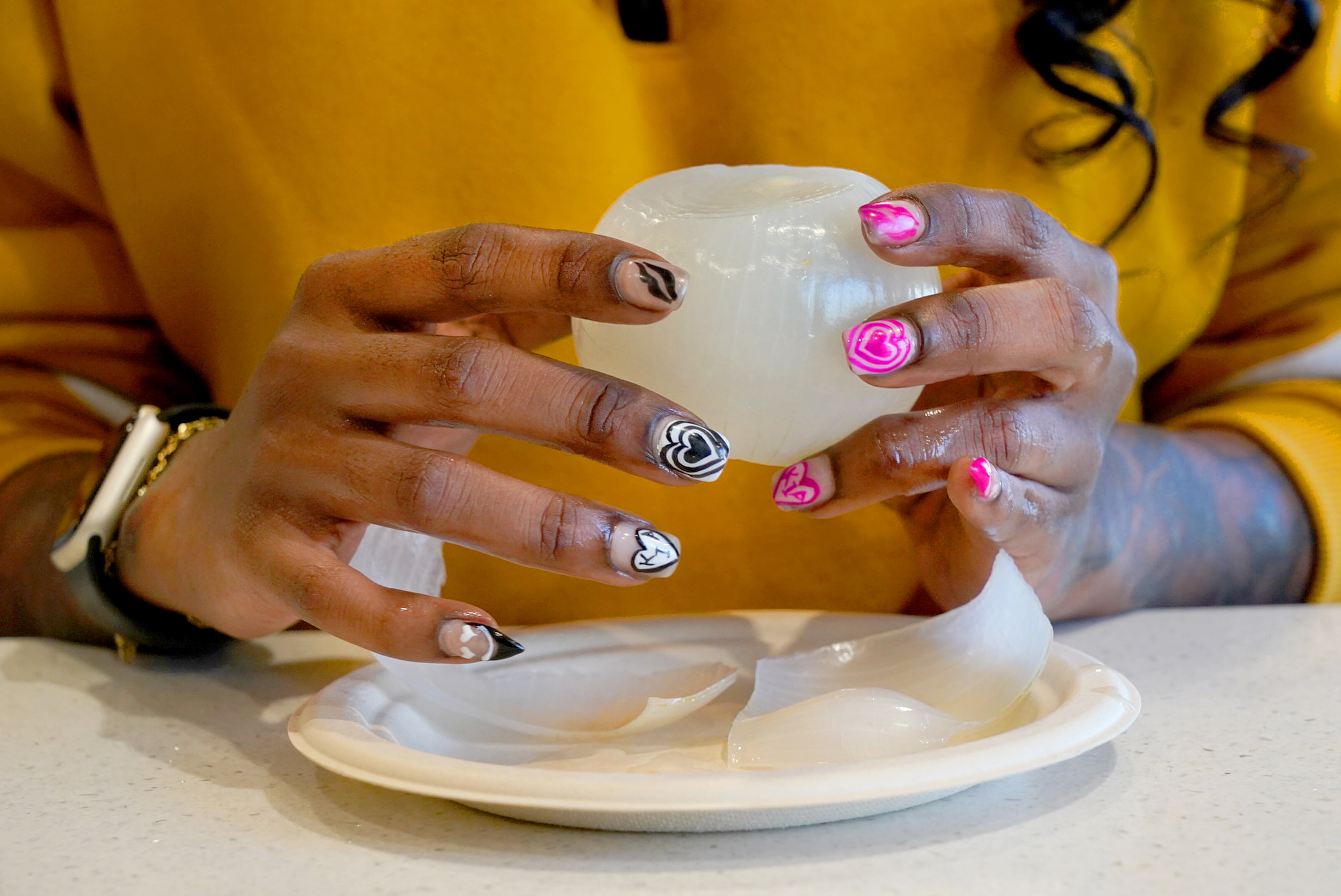 Brittney Howard, 30, of Owings Mills has gone viral on TikTok for her videos about Baltimore's dining scene. One recent surprise: a video about onion pickles, a local staple, that Howard said has had people from across the country messaging her,