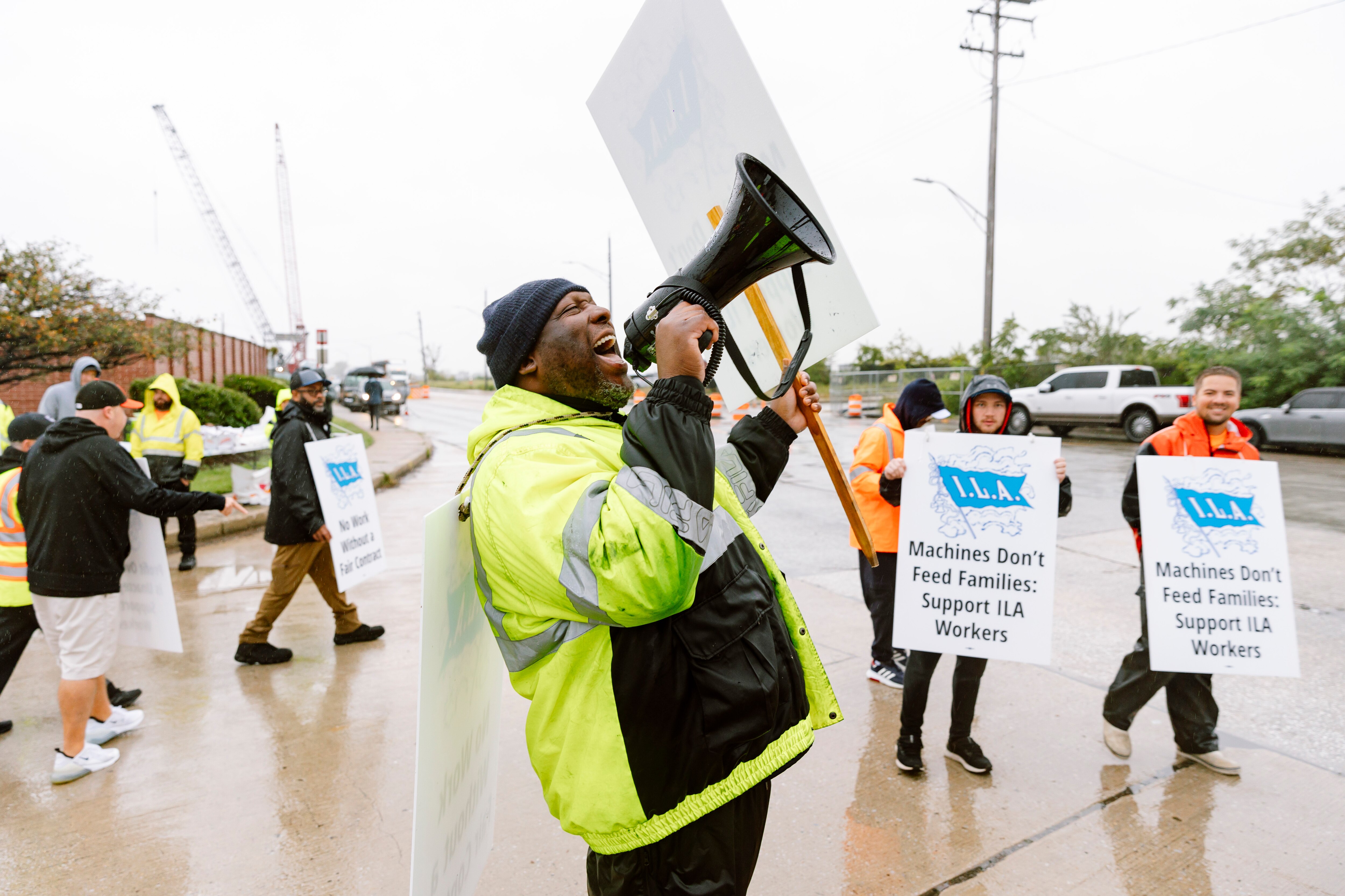 Union members with the International Longshoremen’s Association and Local 333 continue to strike in the rain after over eight hours of picketing against the automation of port work and low wages outside the Dundalk Marine Terminal on Tuesday, October 1, 2024 in Baltimore, MD.