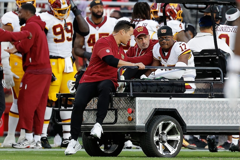 Washington Commanders wide receiver Terry McLaurin is carted off the field during the first half.