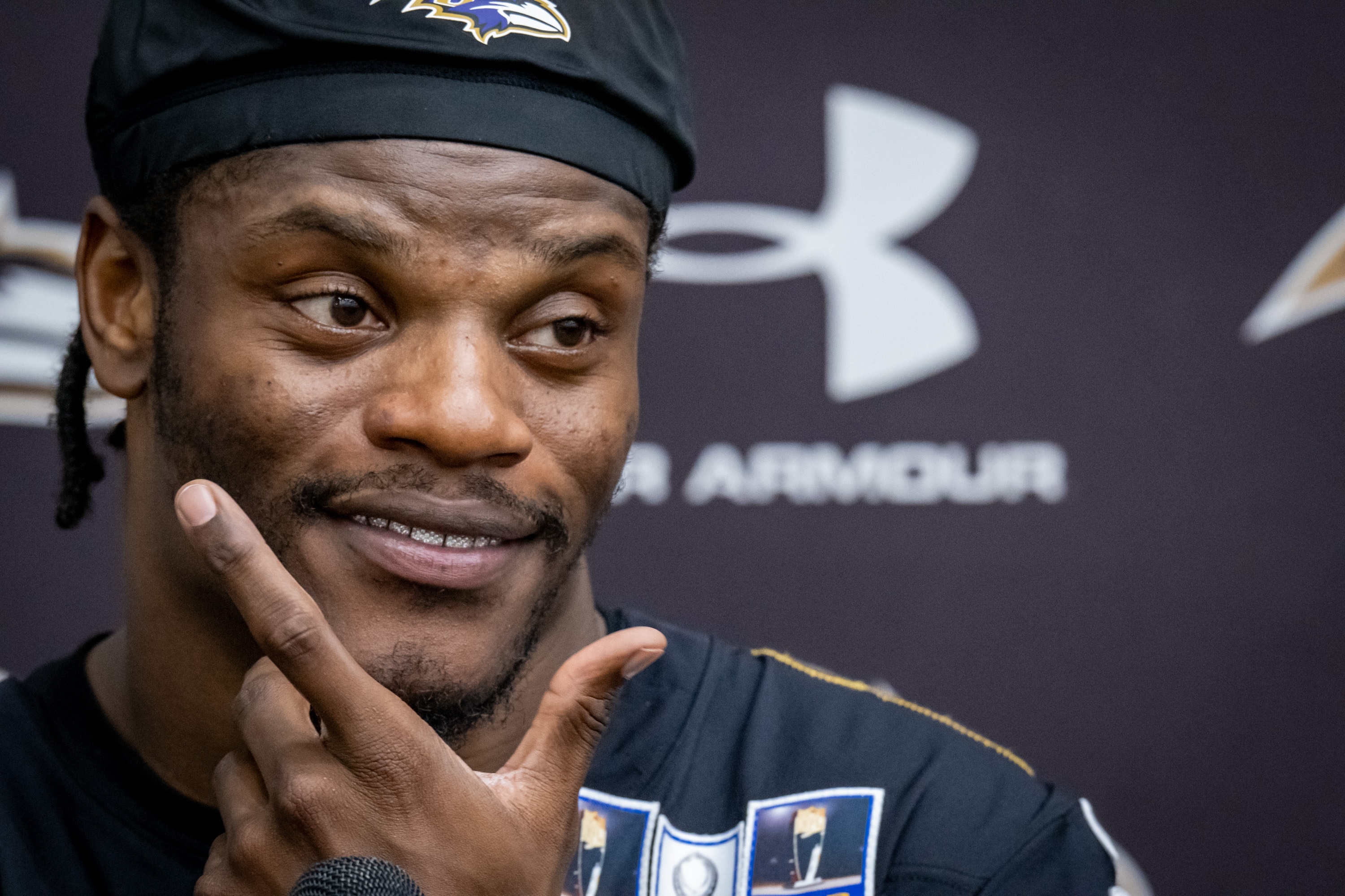 Ravens quarterback Lamar Jackson takes questions from reporters following organized team activities on May 27.