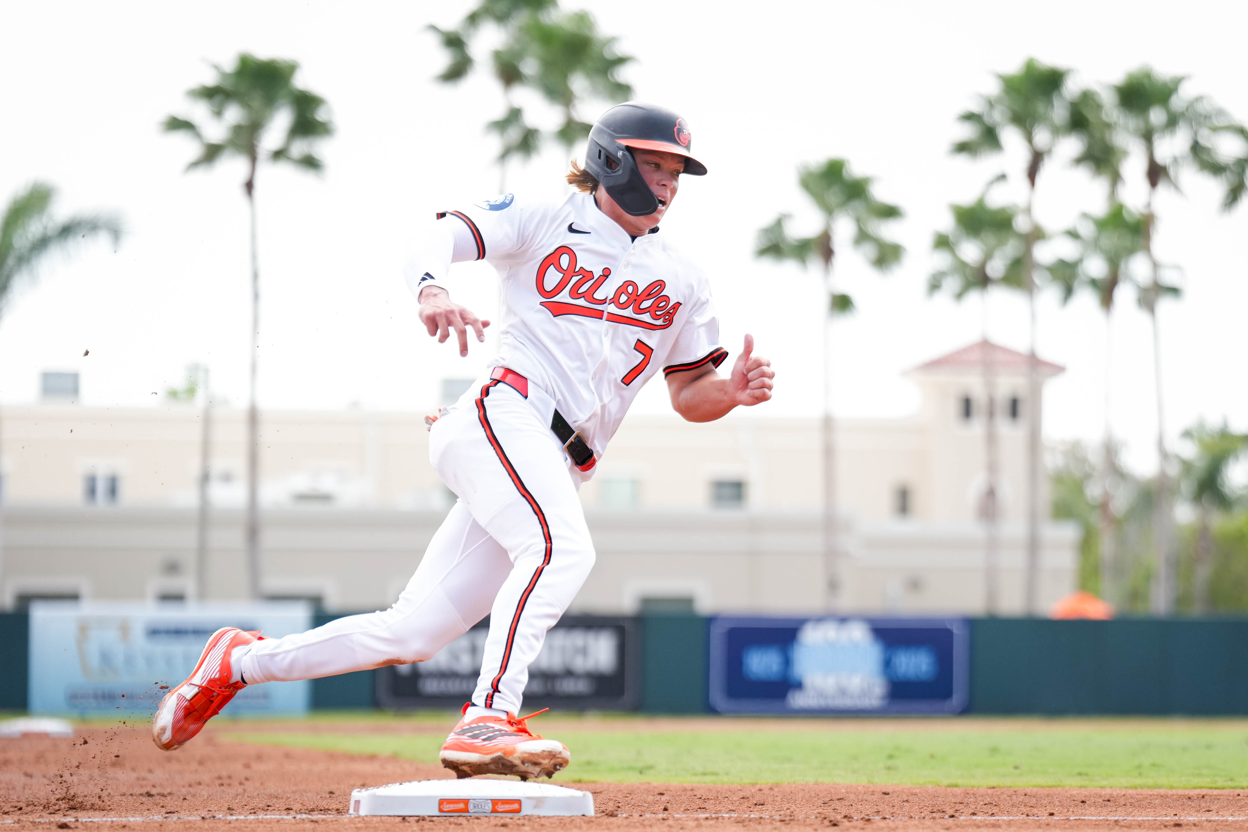 Baltimore Orioles second baseman Jackson Holliday sprints to home plate during a Grapefruit League game against the Pittsburgh Pirates last month.