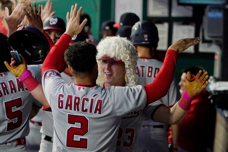 KANSAS CITY, MISSOURI - MAY 26: Corey Dickerson #23 of the Washington Nationals celebrates his three-run home run with Luis Garcia #2 of the Washington Nationals in the sixth inning against the Kansas City Royals at Kauffman Stadium on May 26, 2023 in Kansas City, Missouri.