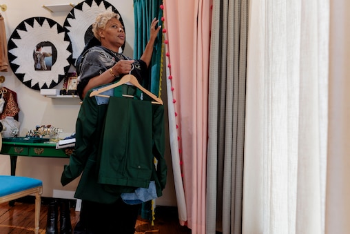 Saturday, April 11, 2026, in Baltimore — Designer Natalie Karyl waits for Shelonda Stokes to try on her custom suit.