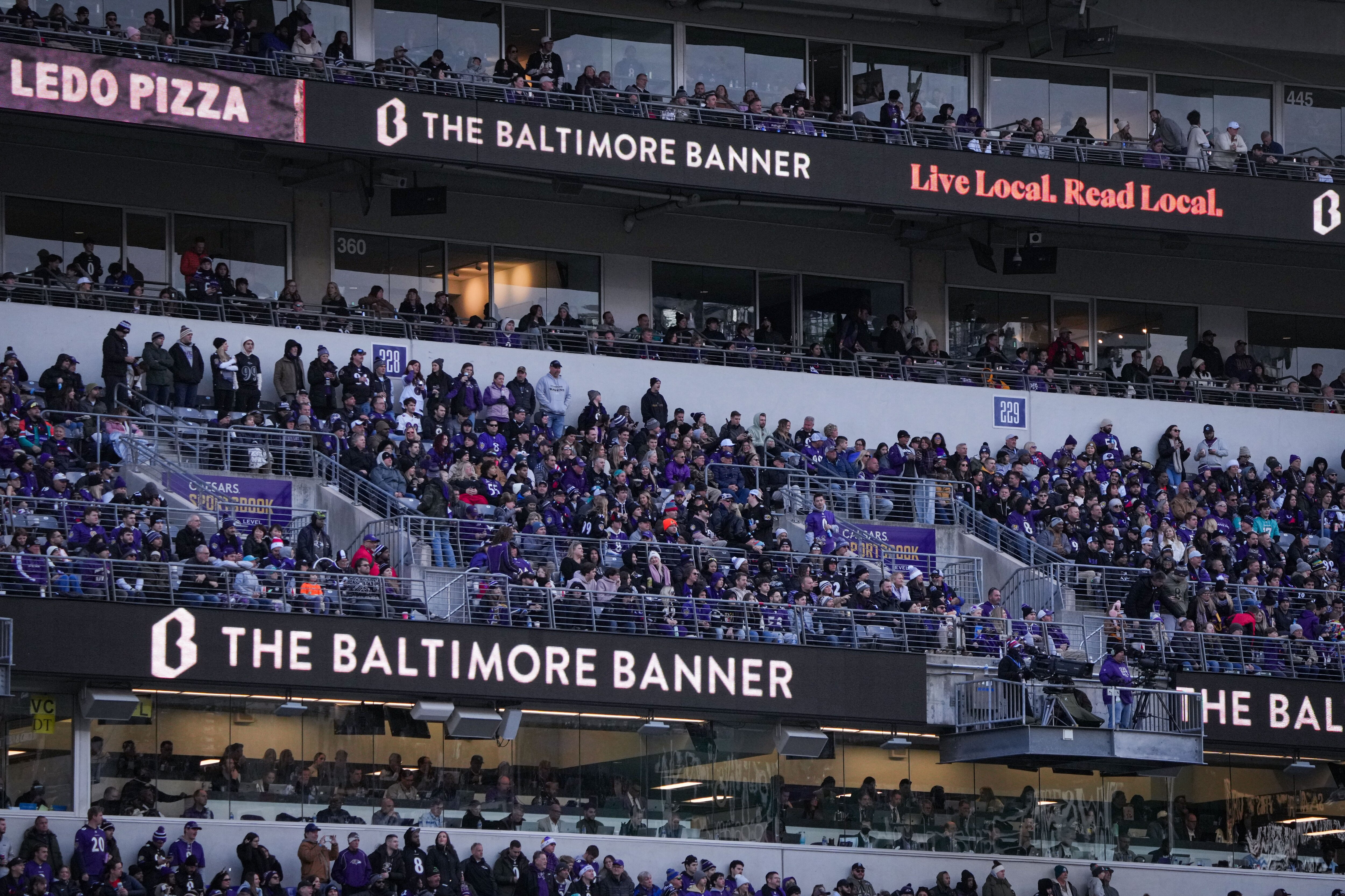 A Baltimore Banner ad runs during a game between the Baltimore Ravens and the Miami Dolphins at M&T Bank Stadium on Sunday, Dec. 31, 2023. The Ravens won, 56-19, to secure the best record in the AFC.