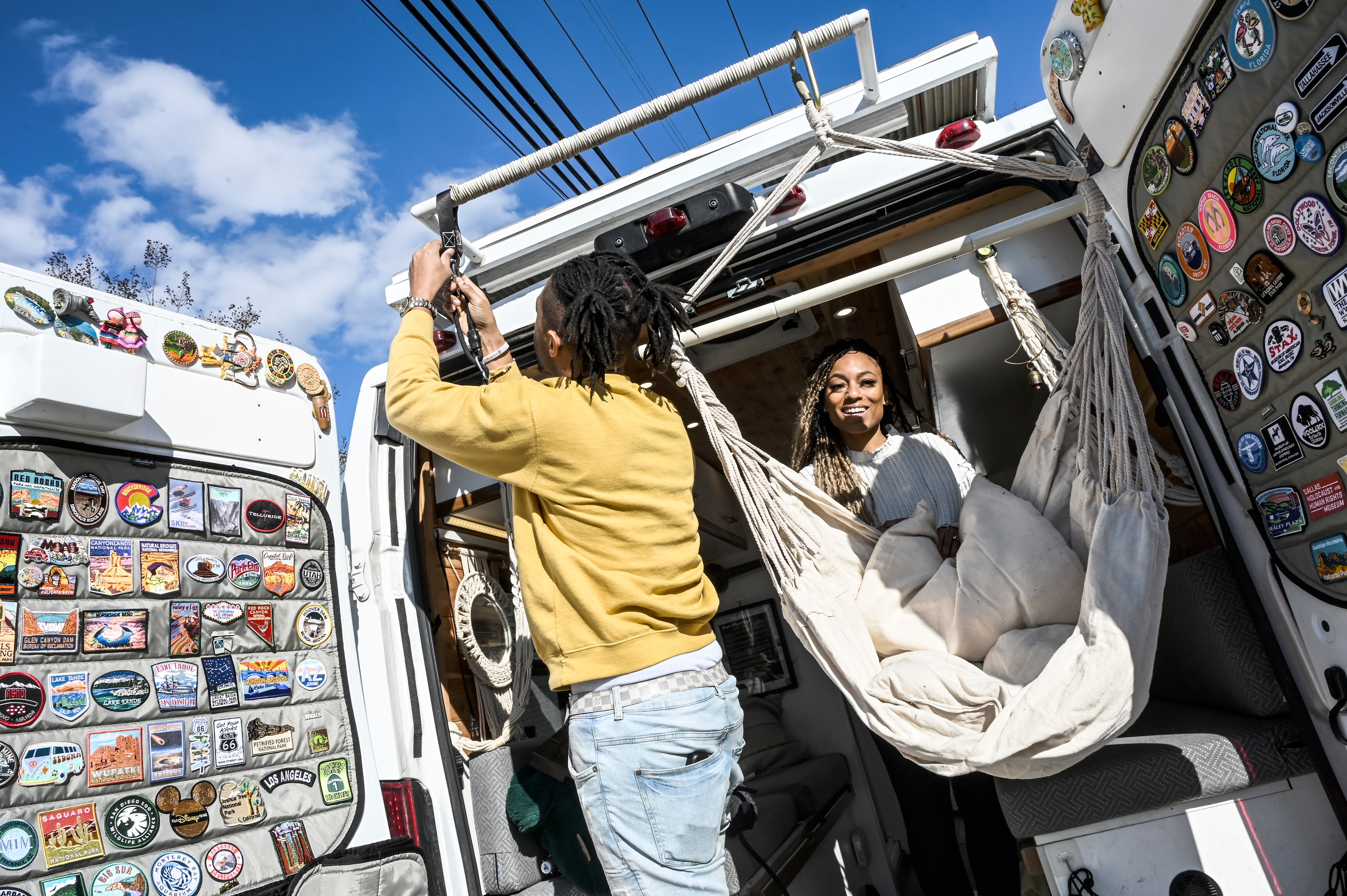 Emmaus sets up the swing seats in the family travel van