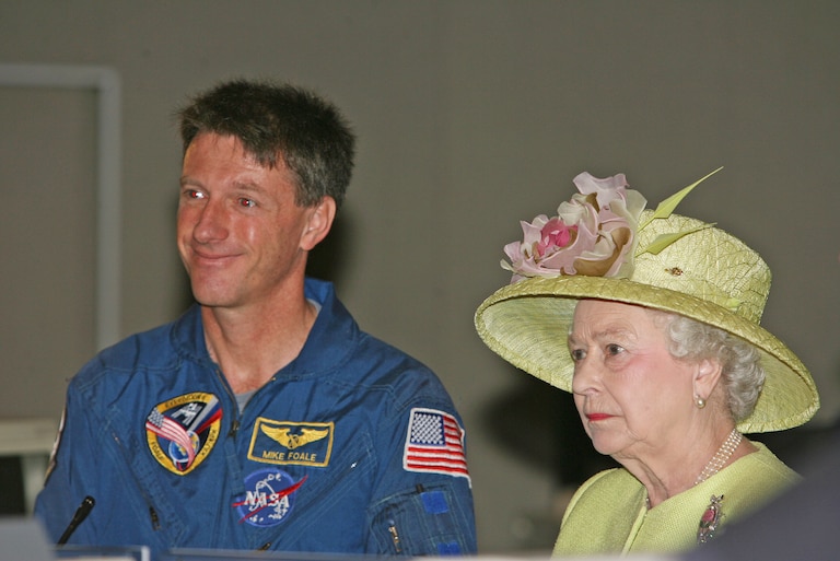 HRH Queen Elizabeth II stands next to Michael Foale as she sees live images from the International Space Station on a monitor in mission control as she visits NASA’s Goddard Space Flight Center on May 7, 2007 in Greenbelt, Maryland. This is the final day of a six day state tour of the United States to commemorate the 400 year anniversary of the settlement of Jamestown. This will be the fourth time that Her Majesty and His Royal Highness have visited the US.