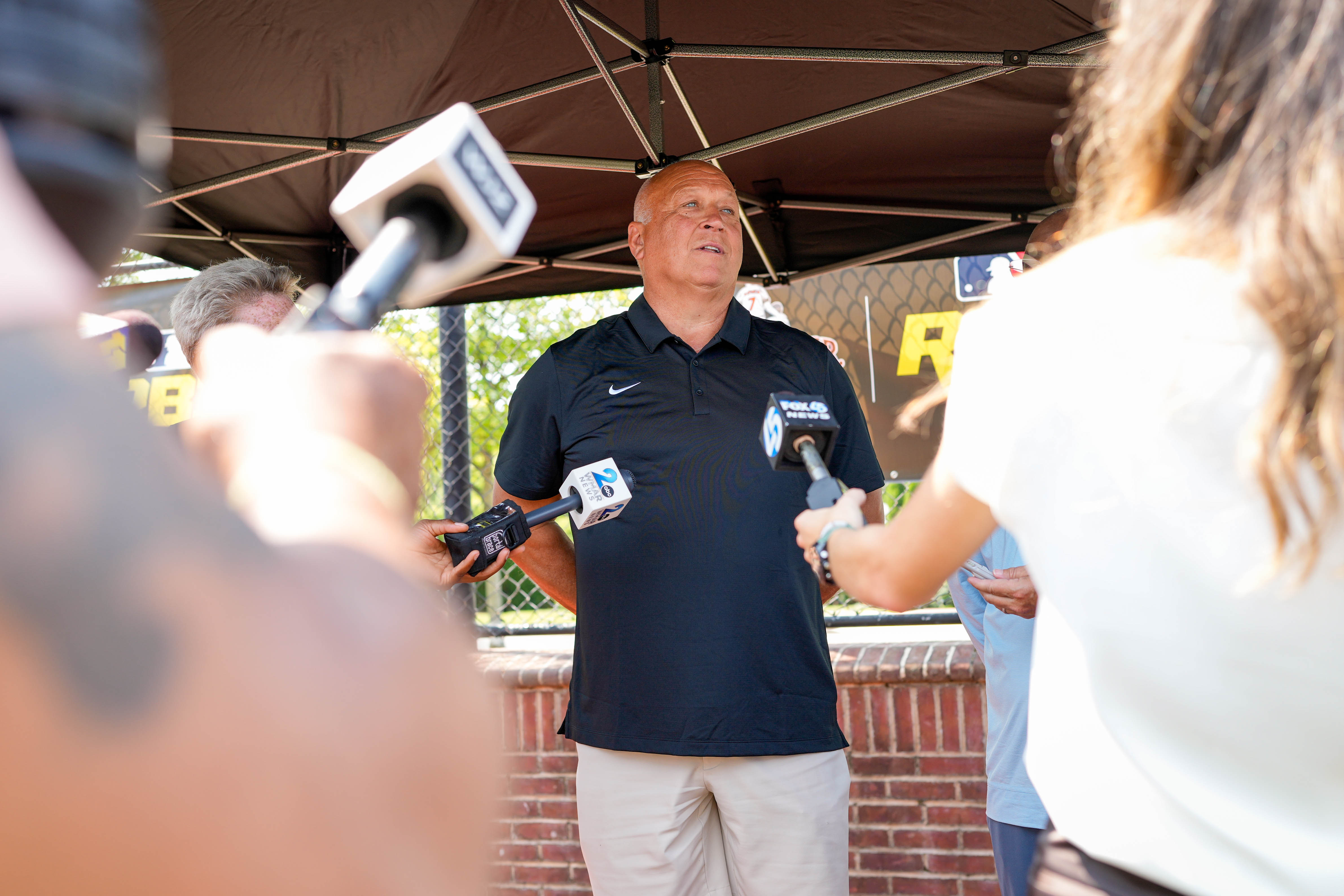 Hall of Famer and minority team owner Cal Ripken Jr. takes questions from reporters during a baseball clinic at Stadium Place, former site of Baltimore’s Memorial Stadium, on Thursday.