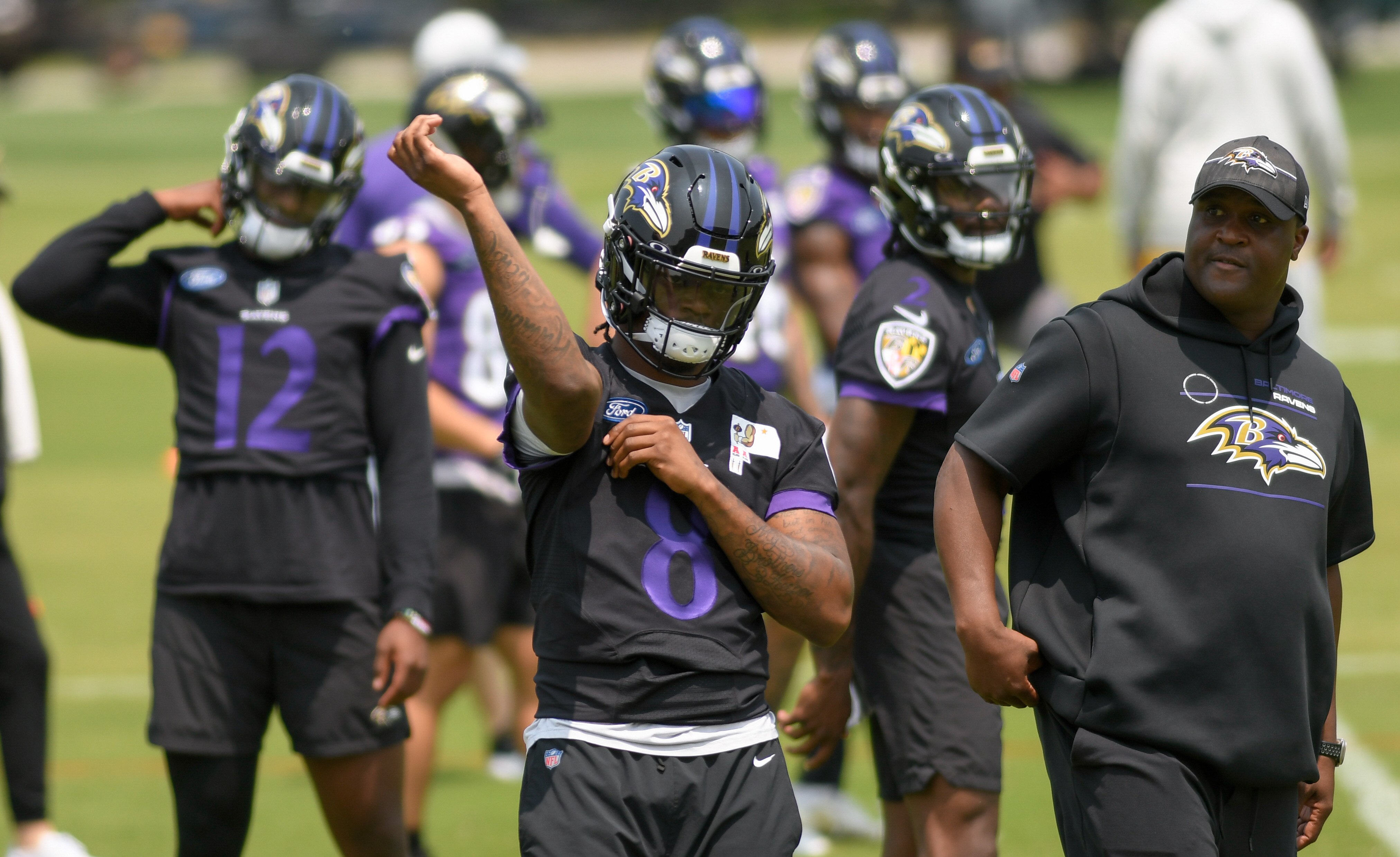 Baltimore Ravens quarterback Lamar Jackson, center, works out during organized team activities Wednesday, May 24, 2023 in Owings Mills.