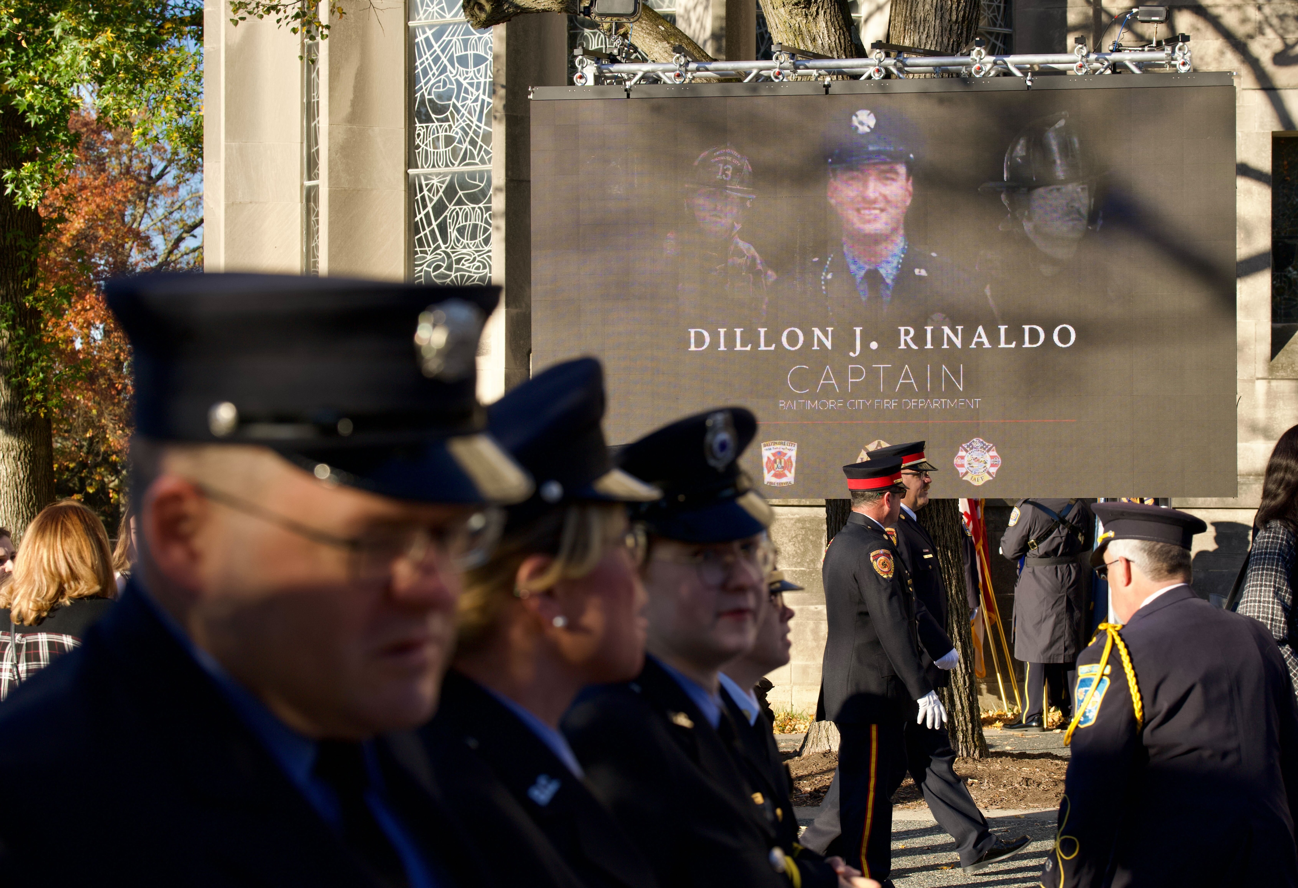 Mourners gather at the memorial service of firefighter Capt. Dillon Rinaldo