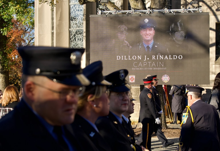 Mourners gather at the memorial service of firefighter Capt. Dillon Rinaldo