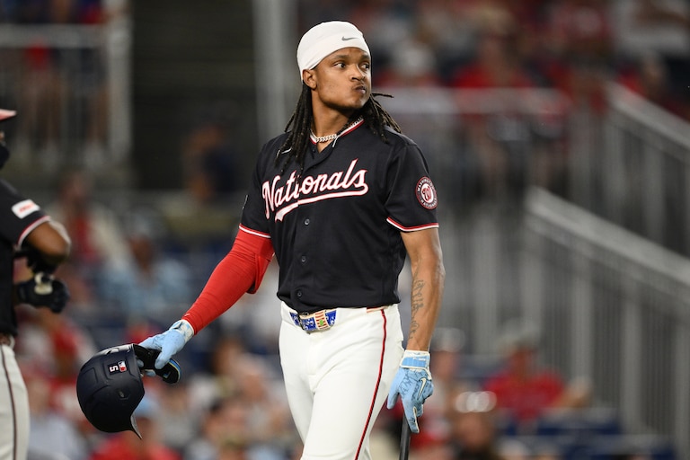 Washington Nationals' CJ Abrams walks back to the dugout after he struck out during the eighth inning of Thursday night's game against the Philadelphia Phillies.