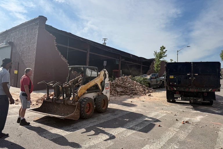 A partial building collapse occurred in East Baltimore, spilling bricks and rubble into the street.