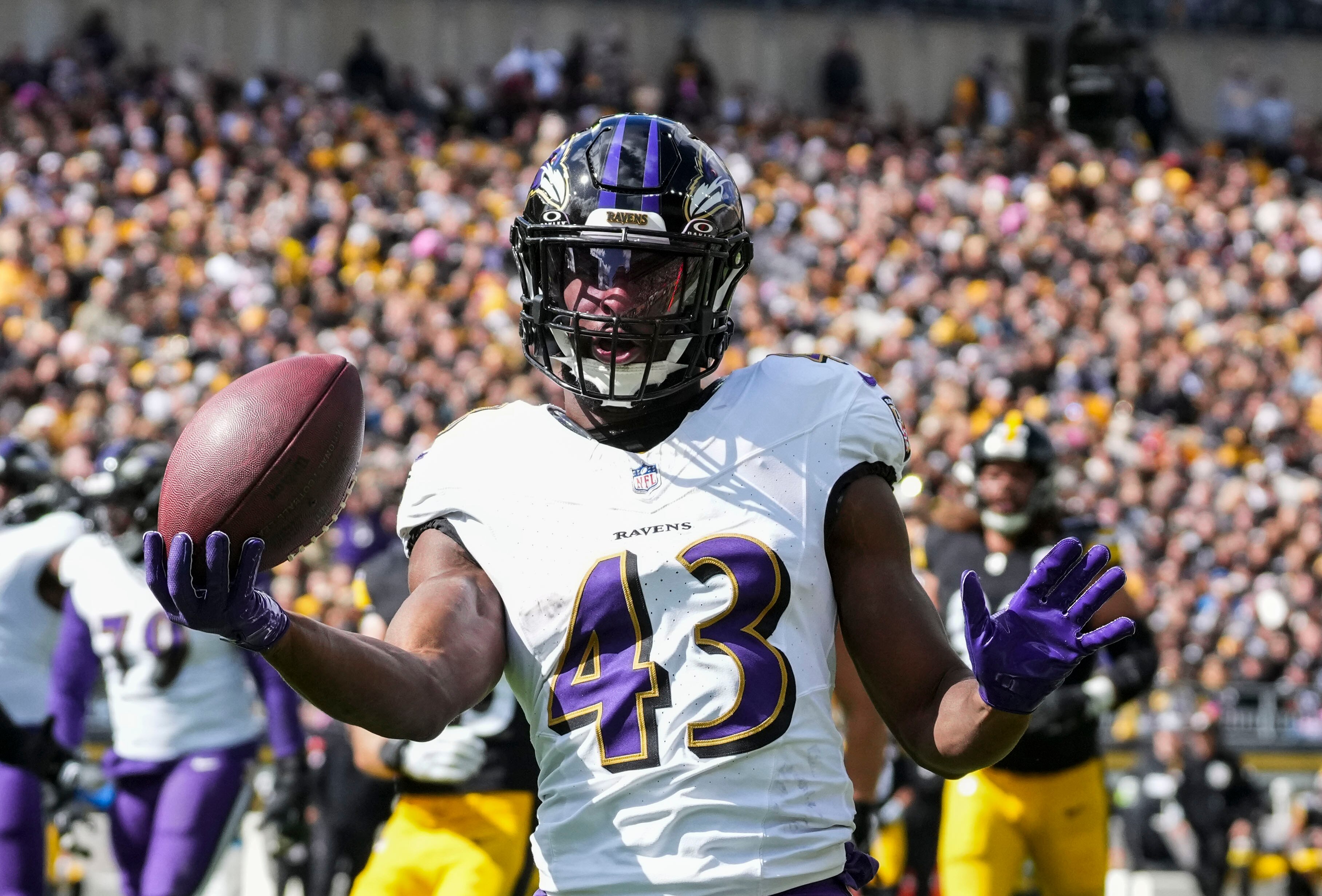 Baltimore Ravens running back Justice Hill (43) celebrates after scoring against Pittsburgh Steelers at Acrisure Stadium in Pittsburgh, Pennsylvania on Sunday, Oct. 8, 2023.