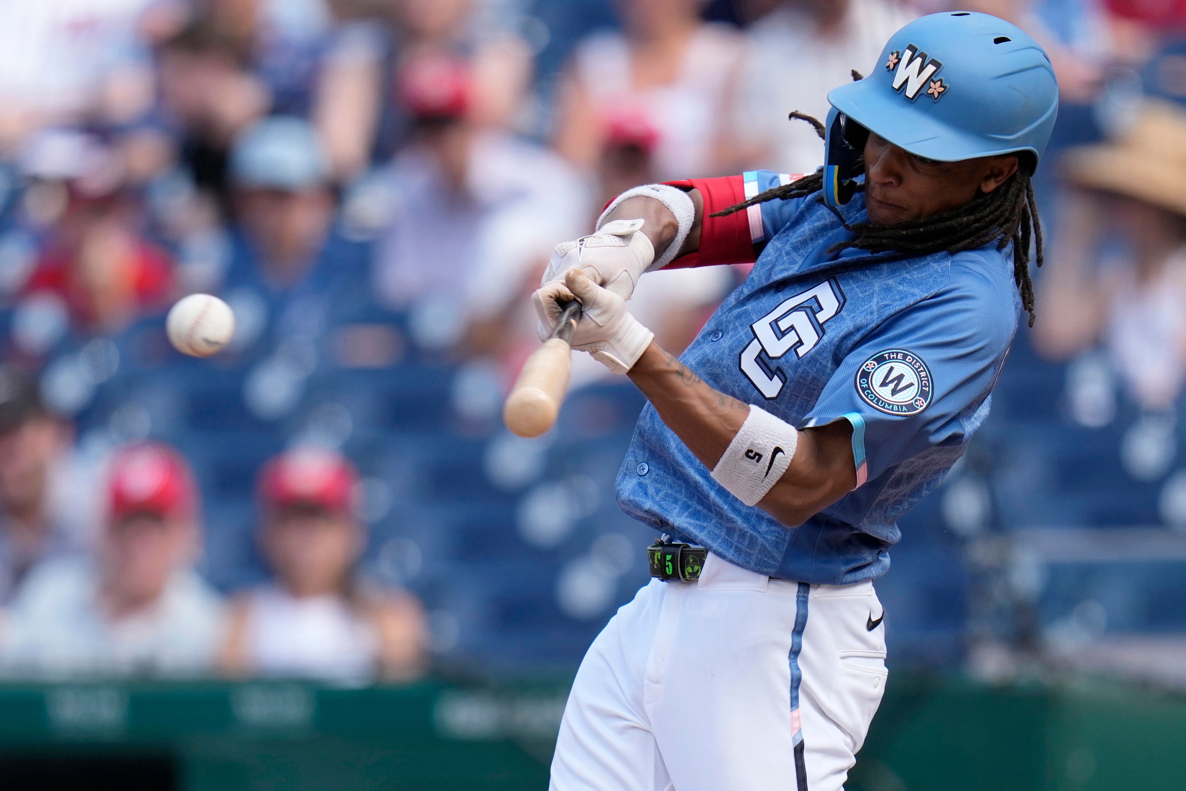 Washington Nationals shortstop CJ Abrams hits an RBI single against the Seattle Mariners on June 13.