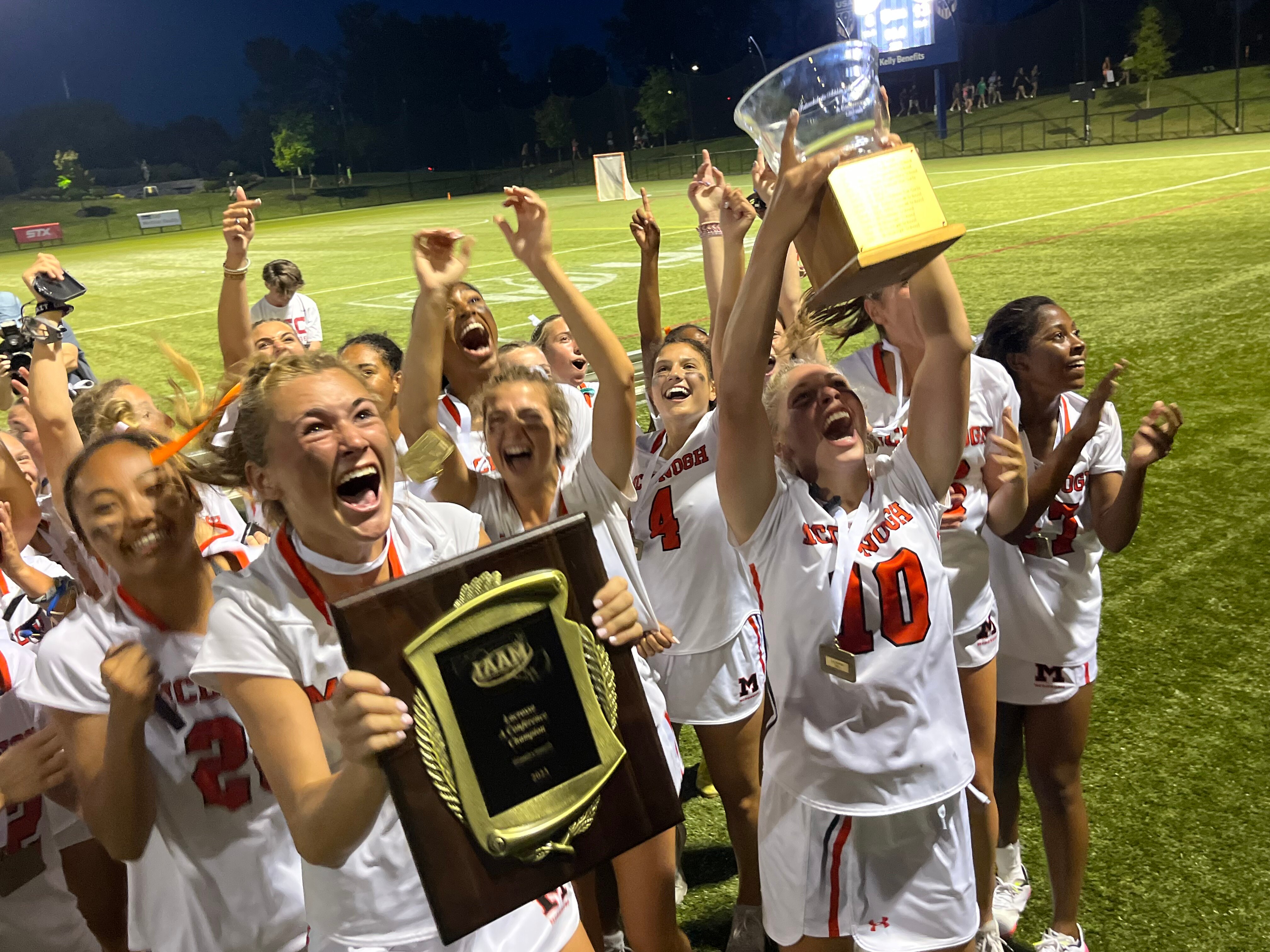 McDonogh's lacrosse team proudly show the IAAM A Conference championship plaque and trophy their fans. The Eagles won their first title since 2019 with a 13-8 dedicion over No. 2 St. Paul's at the USA Lacrosse Complex in Sparks.