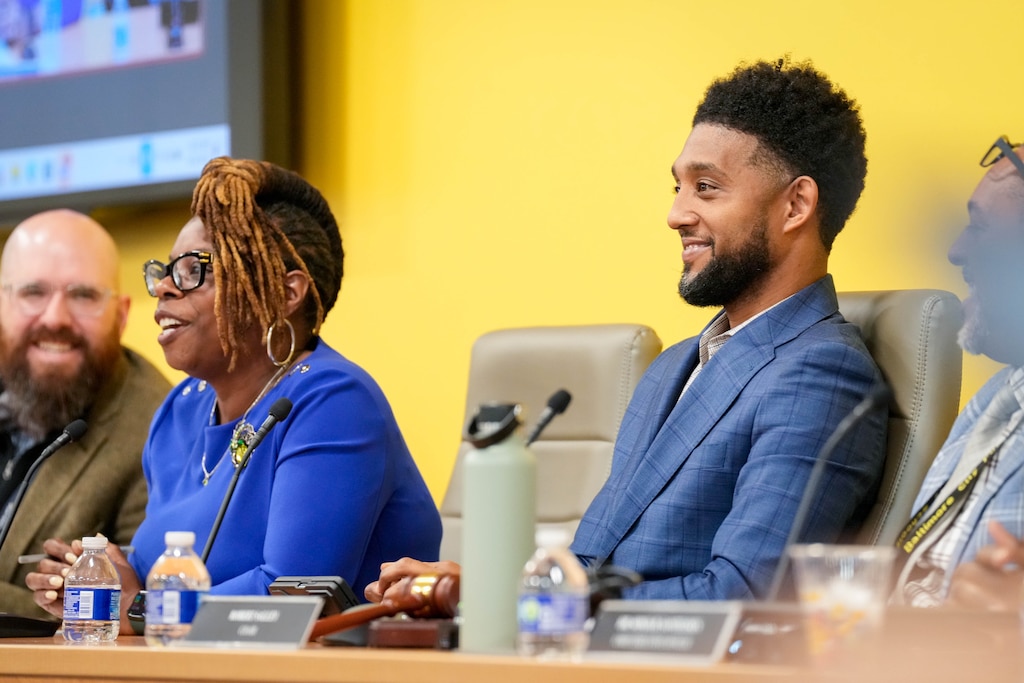 Baltimore City Mayor Brandon Scott, right, gives remarks during a Baltimore City Board of School Commissioners meeting to vote for incoming City Schools CEO Dr. Jermaine Dawson, not pictured, at the Baltimore City Public Schools headquarters in Baltimore, Md. on Monday, April 20, 2026.