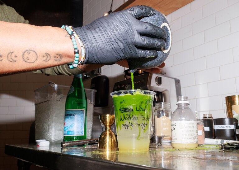 Equitea owner Quentin Vennie makes a matcha drink during the opening part of his month-long matcha shop pop up in the Remington neighborhood of Baltimore, MD on Feb. 22, 2025.