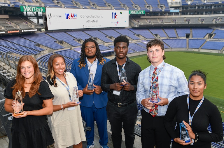 McCormick Unsung Heroes awardees Georgiana Benckini, from left, of Notre Dame Prep, Imani Groce, of Western Tech, Carter Herbert, of Perry Hall, Emmanuel Awogbesan, of Milford Mill, Adam Ossakow, of Hereford, and Brianna Bridgemohan, of Forest Park, stand together at The Baltimore BannerÕs High School Athlete Awards and McCormickÕs Unsung Heroes event at M&T Bank Stadium in Baltimore, Wednesday, June 7, 2023.