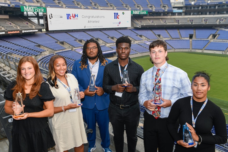 McCormick Unsung Heroes awardees Georgiana Benckini, from left, of Notre Dame Prep, Imani Groce, of Western Tech, Carter Herbert, of Perry Hall, Emmanuel Awogbesan, of Milford Mill, Adam Ossakow, of Hereford, and Brianna Bridgemohan, of Forest Park, stand together at The Baltimore BannerÕs High School Athlete Awards and McCormickÕs Unsung Heroes event at M&T Bank Stadium in Baltimore, Wednesday, June 7, 2023.