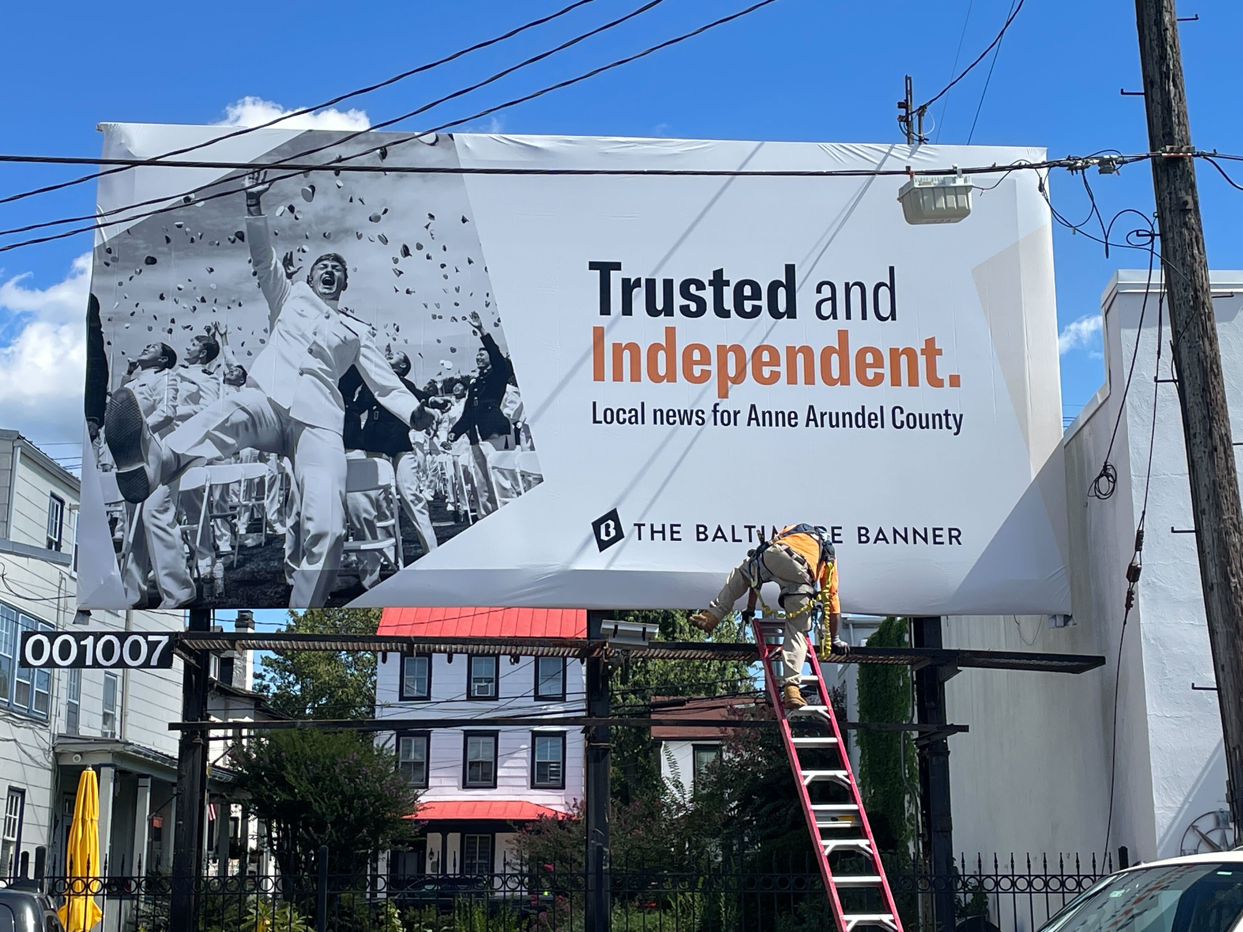 A workman installs The Banner's billboard advertisement on Aug. 26, 2025 at City Dock in Annapolis. Beauty, it turns out, is in the eye of the beholder.