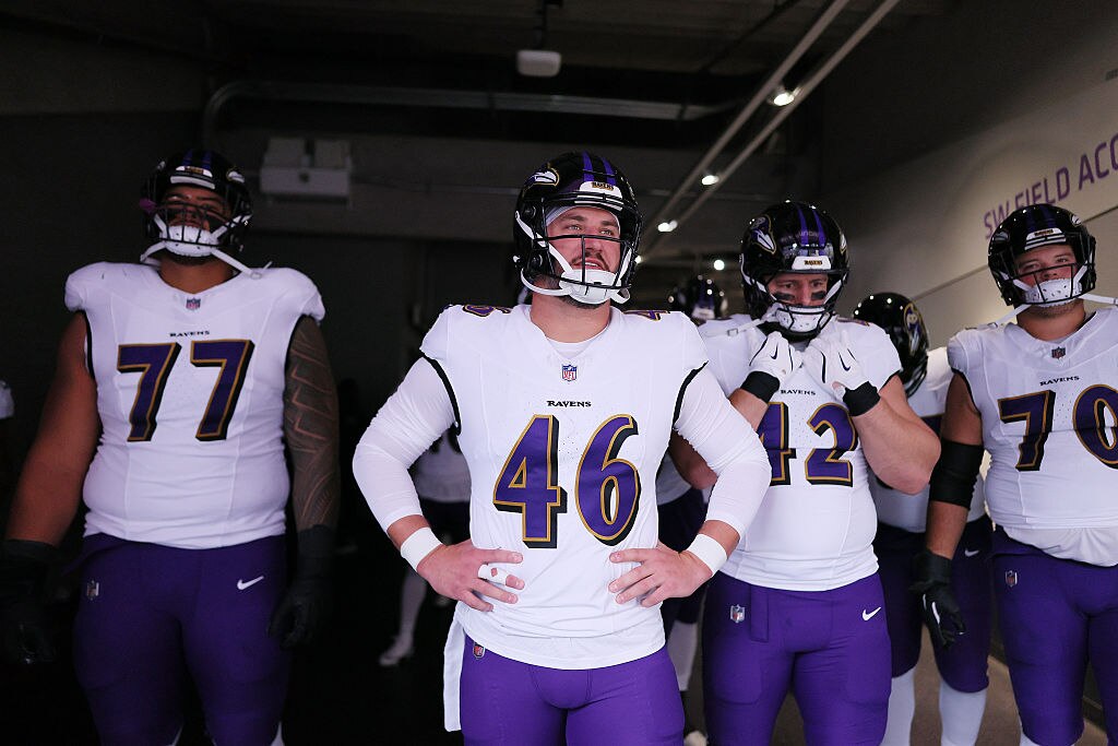 Ravens long snapper Nick Moore (46) of looks on from the tunnel before the team's Week 10 game against the Minnesota Vikings.