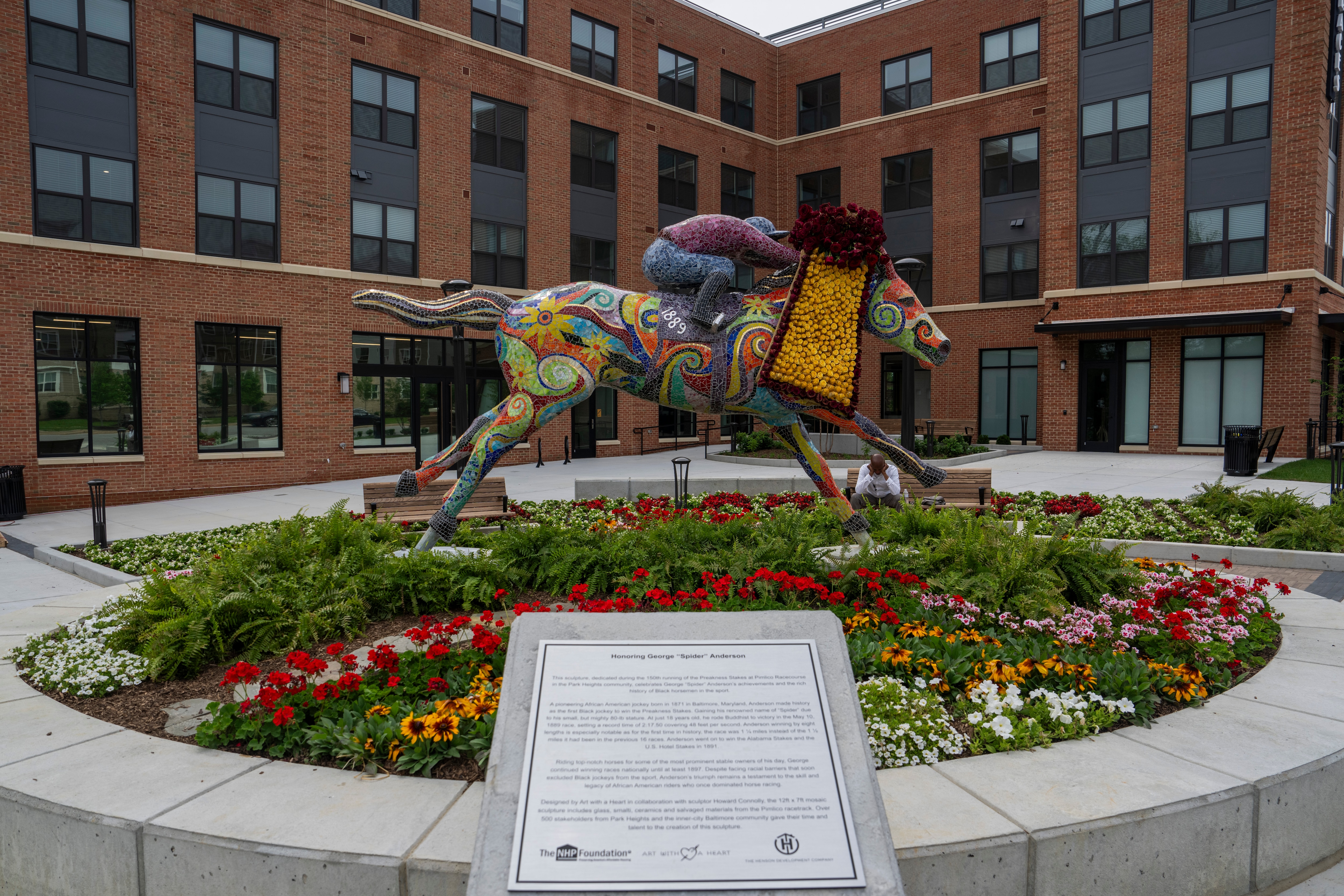Art with a Heart commissioned a sculpture of George "Spider" Anderson, the first Black jockey to win a Preakness hiding the horse Buddhist in 1889.