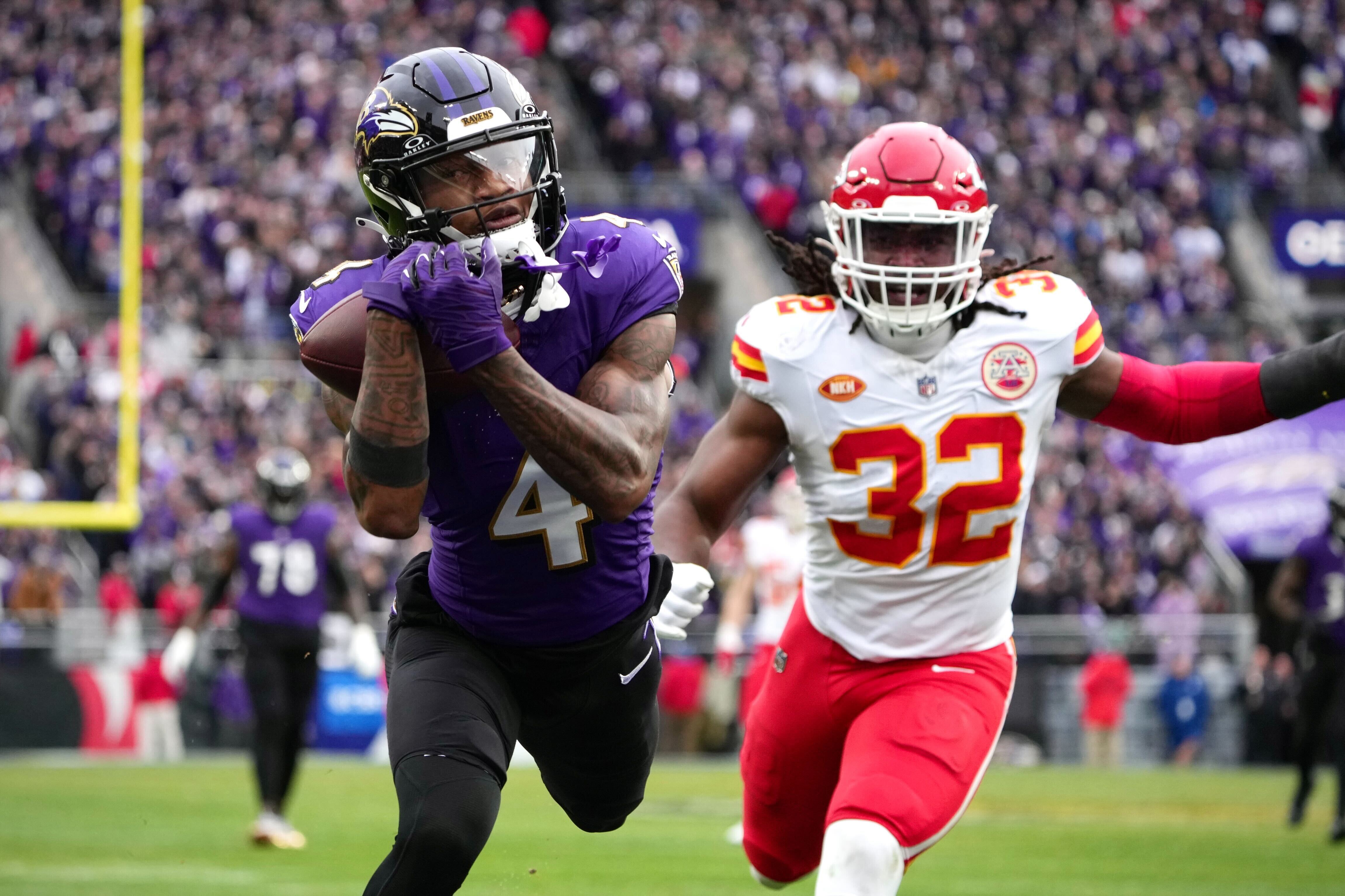 Ravens wide receiver Zay Flowers hauls in a 30-yard touchdown pass from Lamar Jackson during the first quarter of the AFC championship game.