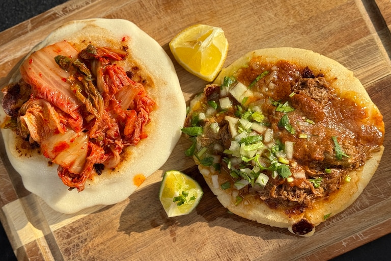 The vegetarian C&C pupusa, left, and birria pupusa from Aru Aru.