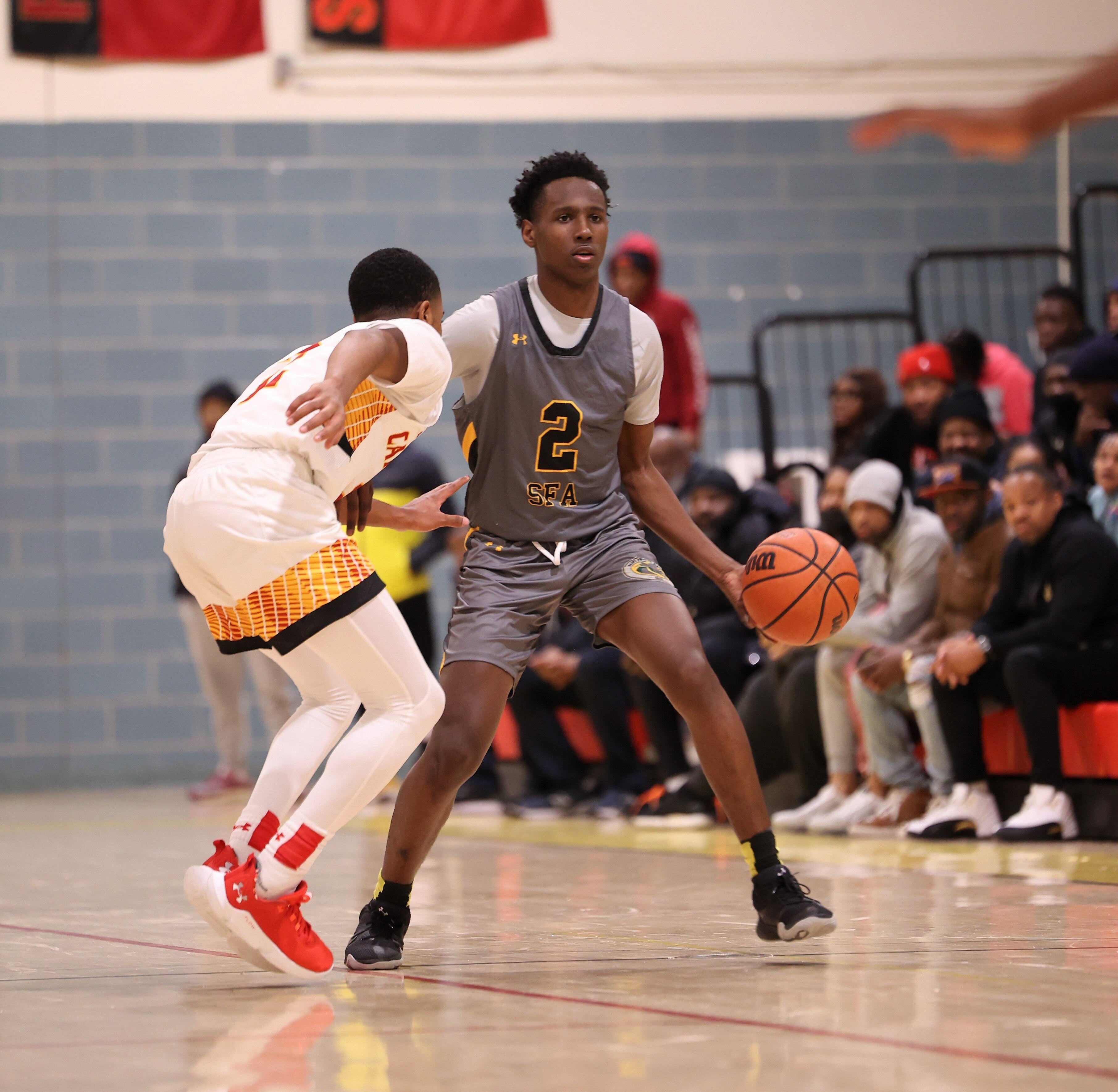 St. Frances' Tyler Jackson is guarded by Calvert Hall's Tyrin Bizzelle during Friday's MIAA A Conference/Baltimore Catholic League basketball contest. Jackson finished with a game-high 22 points as the No. 2 Panthers defeated the Cardinals, 78-55, in Towson.