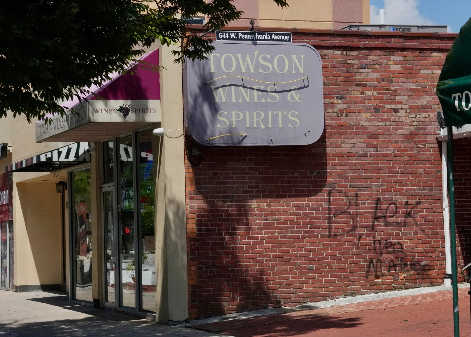 “Black Lives Matter” has been spray-painted on the side of Towson Wines and Spirits. (Kaitlin Newman/The Baltimore Banner)