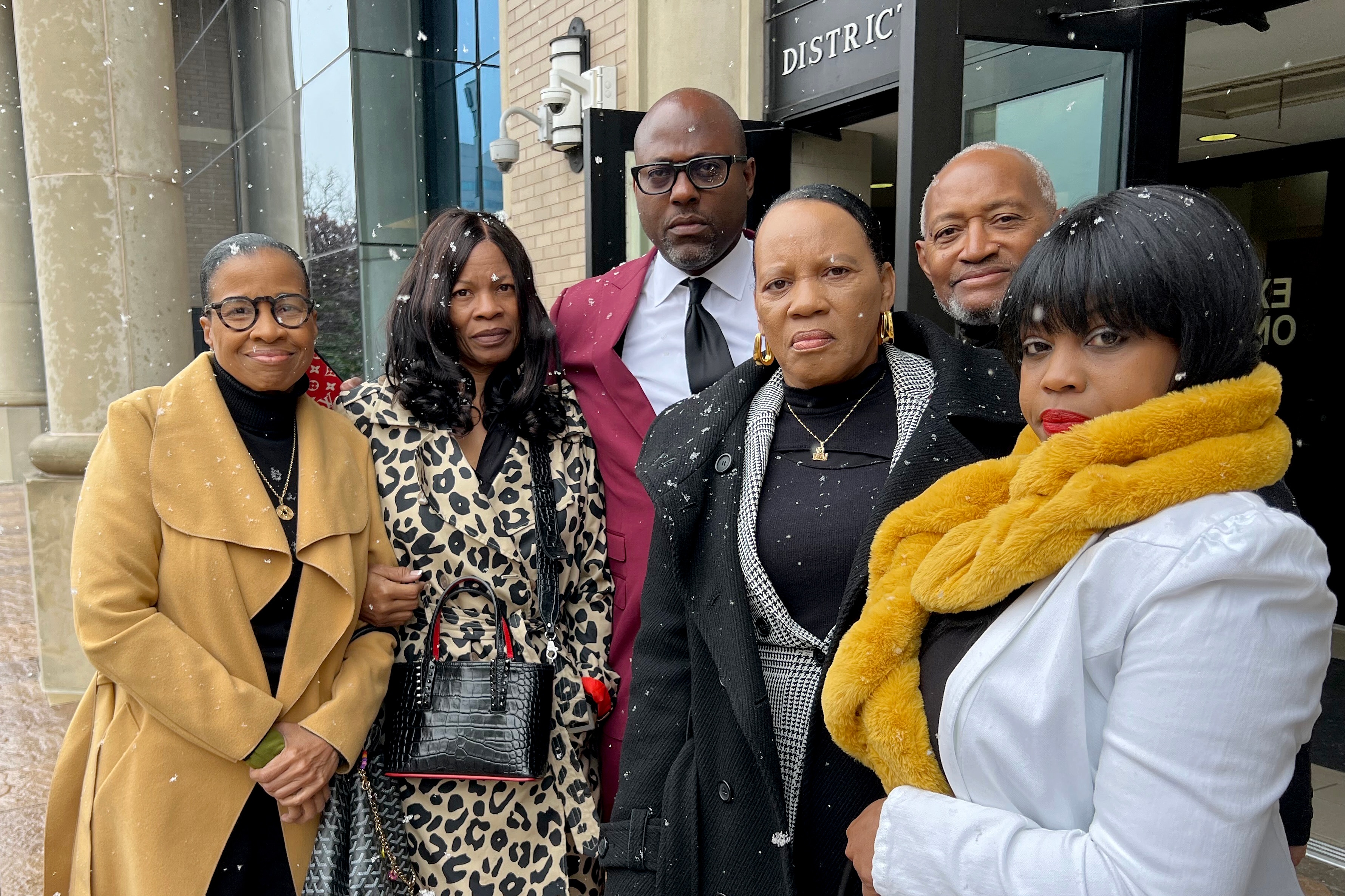 Retired Baltimore City Sheriff's Capt. Jackie Conway, center, stands outside the District Court of Maryland for Baltimore County in Towson on Friday, Nov. 22, 2024, after prosecutors dropped the case against her. Baltimore County Police on Oct. 29 arrested Conway, 60, of Baltimore, on charges of first-and second-degree assault after she reported that a man she was delivering food to through DoorDash exposed himself.