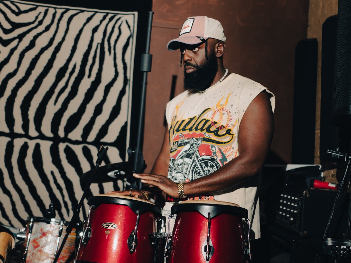 Andrew “December Moon” Johnson adds percussion during an “Iyanu” studio session.